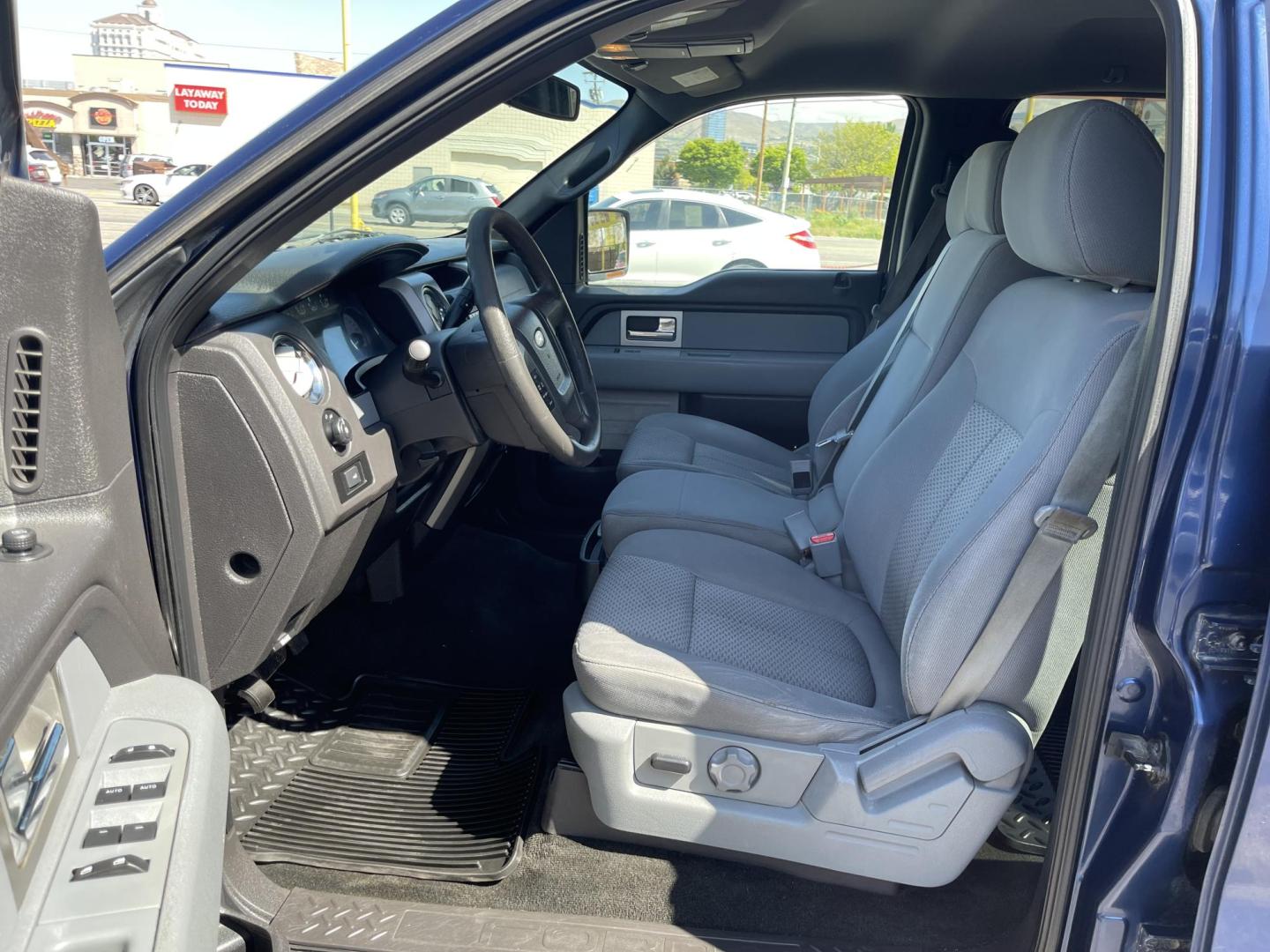 2011 Blue /Gray Ford F-150 FX4 SuperCrew 5.5-ft. Bed 4WD (1FTFW1EF0BF) with an 5.0L V8 engine, 4-Speed Automatic transmission, located at 801 South State Street, Salt Lake City, UT, 84111, (801) 328-0098, 40.751953, -111.888206 - Clean title! Hard find extra clean! Immaculate condition! 6 passenger truck lots of room inside! 4x4 tires are in great shape! Must see truck for anyone looking for a clean 4x4 truck!!! Features: 4x4, Cloth Seats, Alloy Wheels, Rear View Camera, Bed Cover, Satellite Radio Ready, Bed Liner,Tow Hitch - Photo#14