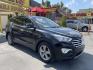 2013 Black /Tan Hyundai Santa Fe GLS AWD (KM8SNDHF2DU) with an 3.3L V6 DOHC 24V engine, 6-Speed Automatic transmission, located at 801 South State Street, Salt Lake City, UT, 84111, (801) 328-0098, 40.751953, -111.888206 - Super clean 2013 Santa Fe inside and out very clean SUV! Clean title! 3rd row seating! Leather Seats! All Wheel Drive! Approved for up to a 5 year bumper to bumper warranty that covers every major part! This is a must see for anyone looking for a clean SUV with 3rd row seating! Features: 4WD/AWD, A - Photo#3