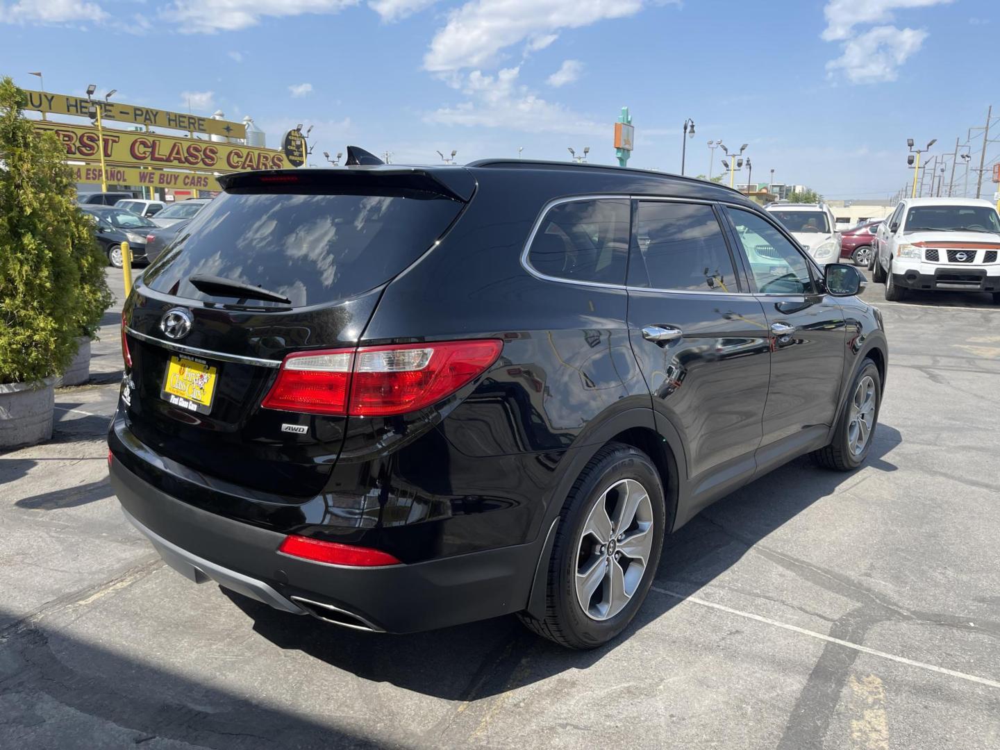2013 Black /Tan Hyundai Santa Fe GLS AWD (KM8SNDHF2DU) with an 3.3L V6 DOHC 24V engine, 6-Speed Automatic transmission, located at 801 South State Street, Salt Lake City, UT, 84111, (801) 328-0098, 40.751953, -111.888206 - Super clean 2013 Santa Fe inside and out very clean SUV! Clean title! 3rd row seating! Leather Seats! All Wheel Drive! Approved for up to a 5 year bumper to bumper warranty that covers every major part! This is a must see for anyone looking for a clean SUV with 3rd row seating! Features: 4WD/AWD, A - Photo#5