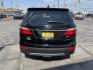 2013 Black /Tan Hyundai Santa Fe GLS AWD (KM8SNDHF2DU) with an 3.3L V6 DOHC 24V engine, 6-Speed Automatic transmission, located at 801 South State Street, Salt Lake City, UT, 84111, (801) 328-0098, 40.751953, -111.888206 - Super clean 2013 Santa Fe inside and out very clean SUV! Clean title! 3rd row seating! Leather Seats! All Wheel Drive! Approved for up to a 5 year bumper to bumper warranty that covers every major part! This is a must see for anyone looking for a clean SUV with 3rd row seating! Features: 4WD/AWD, A - Photo#6