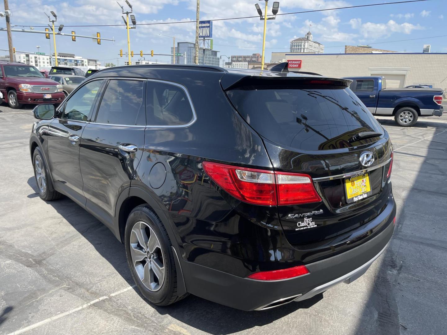 2013 Black /Tan Hyundai Santa Fe GLS AWD (KM8SNDHF2DU) with an 3.3L V6 DOHC 24V engine, 6-Speed Automatic transmission, located at 801 South State Street, Salt Lake City, UT, 84111, (801) 328-0098, 40.751953, -111.888206 - Super clean 2013 Santa Fe inside and out very clean SUV! Clean title! 3rd row seating! Leather Seats! All Wheel Drive! Approved for up to a 5 year bumper to bumper warranty that covers every major part! This is a must see for anyone looking for a clean SUV with 3rd row seating! Features: 4WD/AWD, A - Photo#7