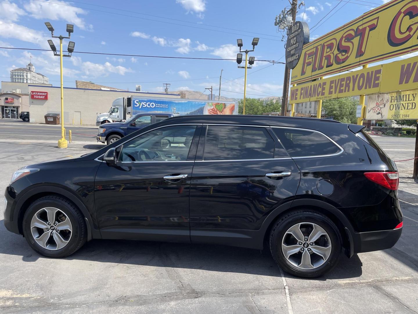 2013 Black /Tan Hyundai Santa Fe GLS AWD (KM8SNDHF2DU) with an 3.3L V6 DOHC 24V engine, 6-Speed Automatic transmission, located at 801 South State Street, Salt Lake City, UT, 84111, (801) 328-0098, 40.751953, -111.888206 - Super clean 2013 Santa Fe inside and out very clean SUV! Clean title! 3rd row seating! Leather Seats! All Wheel Drive! Approved for up to a 5 year bumper to bumper warranty that covers every major part! This is a must see for anyone looking for a clean SUV with 3rd row seating! Features: 4WD/AWD, A - Photo#8