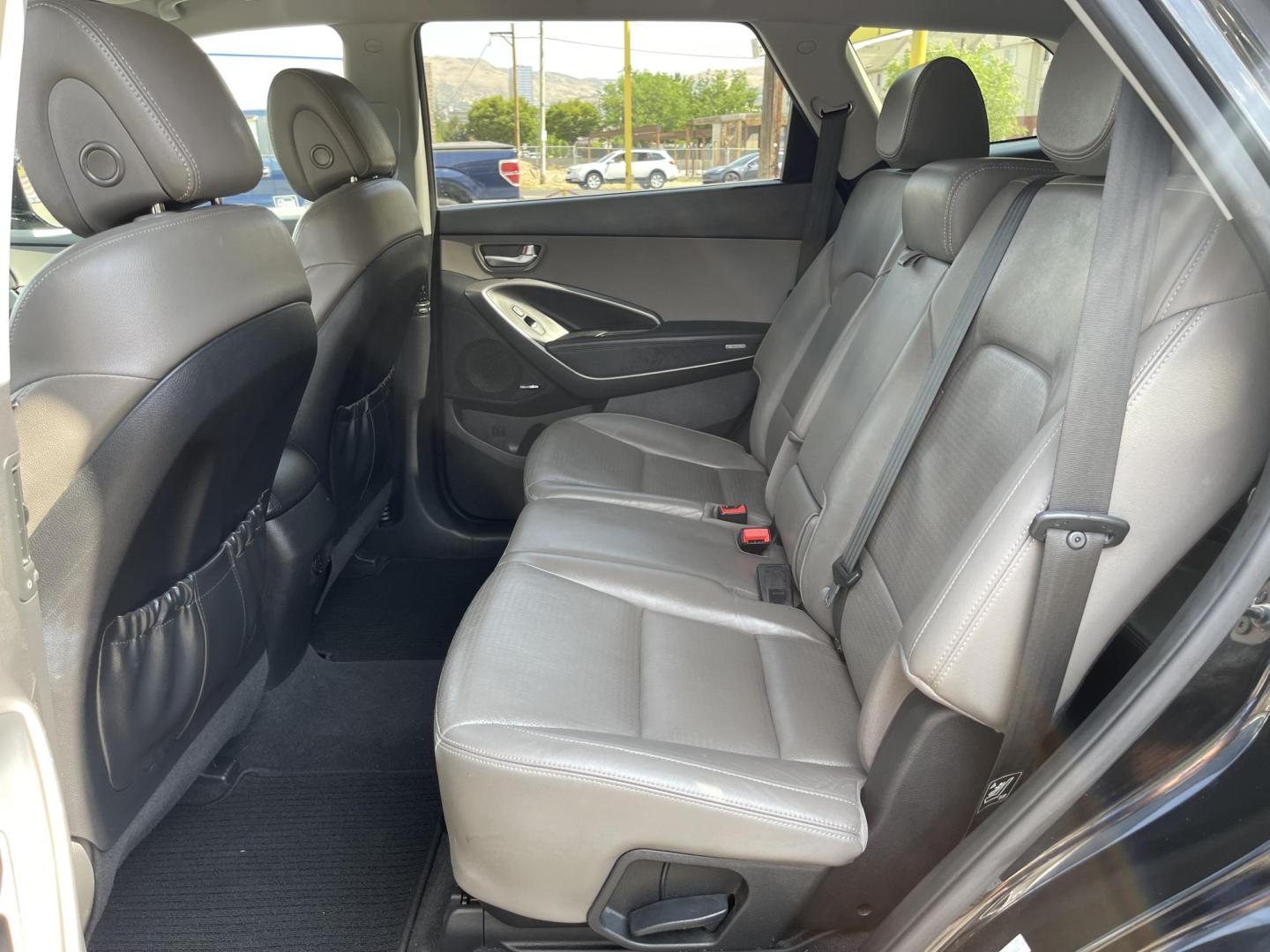 2013 Black /Tan Hyundai Santa Fe GLS AWD (KM8SNDHF2DU) with an 3.3L V6 DOHC 24V engine, 6-Speed Automatic transmission, located at 801 South State Street, Salt Lake City, UT, 84111, (801) 328-0098, 40.751953, -111.888206 - Super clean 2013 Santa Fe inside and out very clean SUV! Clean title! 3rd row seating! Leather Seats! All Wheel Drive! Approved for up to a 5 year bumper to bumper warranty that covers every major part! This is a must see for anyone looking for a clean SUV with 3rd row seating! Features: 4WD/AWD, A - Photo#14