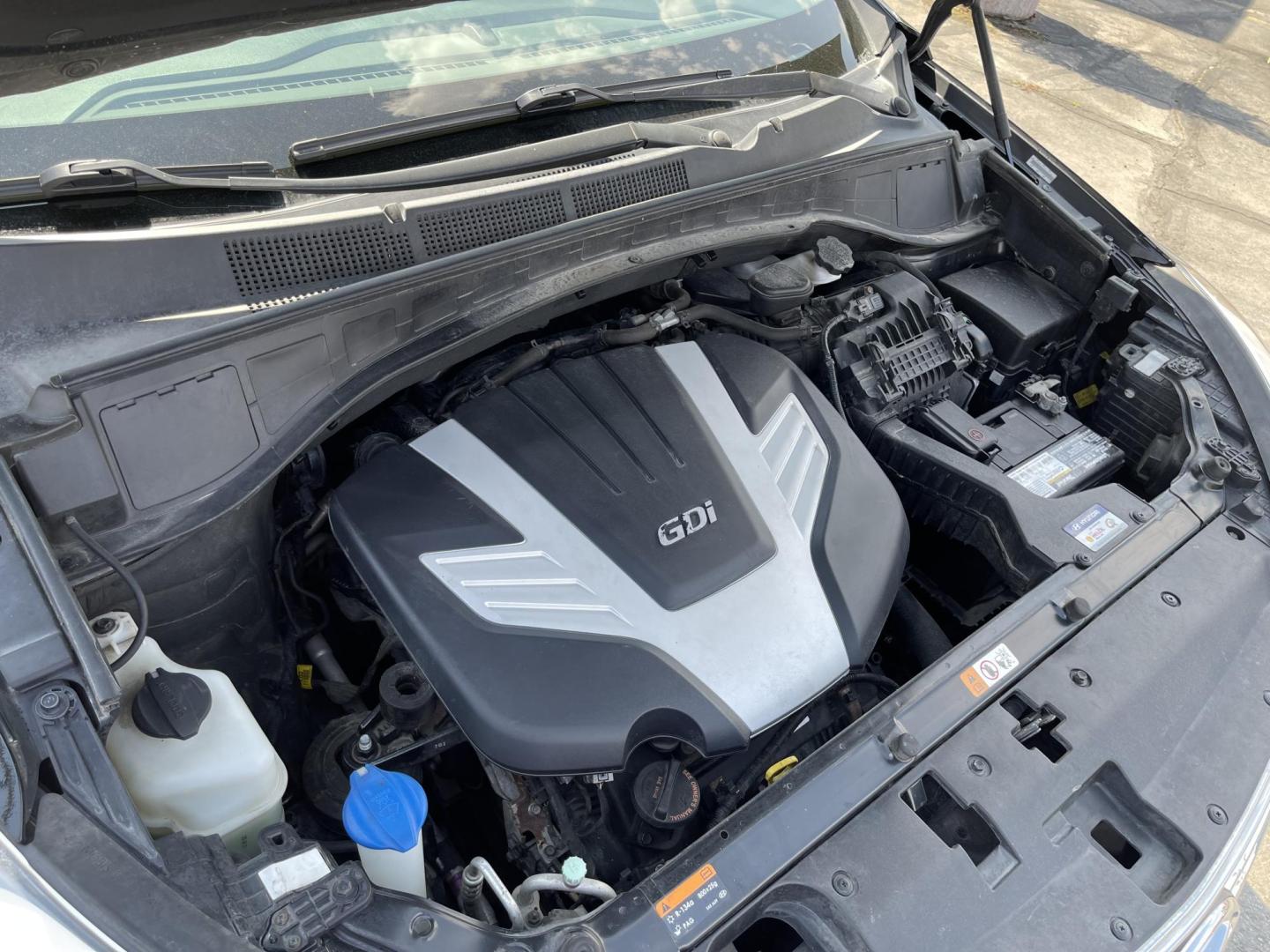 2013 Black /Tan Hyundai Santa Fe GLS AWD (KM8SNDHF2DU) with an 3.3L V6 DOHC 24V engine, 6-Speed Automatic transmission, located at 801 South State Street, Salt Lake City, UT, 84111, (801) 328-0098, 40.751953, -111.888206 - Super clean 2013 Santa Fe inside and out very clean SUV! Clean title! 3rd row seating! Leather Seats! All Wheel Drive! Approved for up to a 5 year bumper to bumper warranty that covers every major part! This is a must see for anyone looking for a clean SUV with 3rd row seating! Features: 4WD/AWD, A - Photo#23
