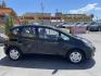 2012 Black /BLACK Honda Fit 5-Speed AT (JHMGE8H34CS) with an 1.5L L4 SOHC 16V engine, 5-Speed Automatic transmission, located at 801 South State Street, Salt Lake City, UT, 84111, (801) 328-0098, 40.751953, -111.888206 - Clean Title only 2 previous owners on the Carfax history report! Excellent gas mileage this 2012 Honda Fit gets up to 28 MPG city and 35 MPG highway!!! This is a must see for anyone looking for a nice affordable car!!! Features: Cloth Seats, ABS Brakes, AM/FM Stereo, Air Conditioning, Automatic Tra - Photo#4