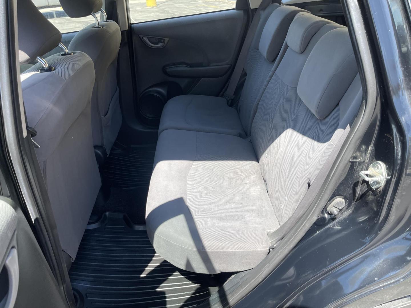 2012 Black /BLACK Honda Fit 5-Speed AT (JHMGE8H34CS) with an 1.5L L4 SOHC 16V engine, 5-Speed Automatic transmission, located at 801 South State Street, Salt Lake City, UT, 84111, (801) 328-0098, 40.751953, -111.888206 - Clean Title only 2 previous owners on the Carfax history report! Excellent gas mileage this 2012 Honda Fit gets up to 28 MPG city and 35 MPG highway!!! This is a must see for anyone looking for a nice affordable car!!! Features: Cloth Seats, ABS Brakes, AM/FM Stereo, Air Conditioning, Automatic Tra - Photo#12