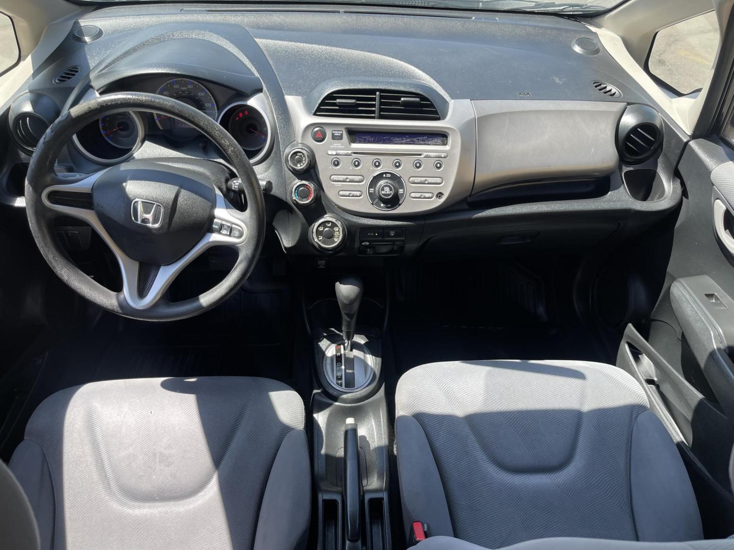 2012 Black /BLACK Honda Fit 5-Speed AT (JHMGE8H34CS) with an 1.5L L4 SOHC 16V engine, 5-Speed Automatic transmission, located at 801 South State Street, Salt Lake City, UT, 84111, (801) 328-0098, 40.751953, -111.888206 - Clean Title only 2 previous owners on the Carfax history report! Excellent gas mileage this 2012 Honda Fit gets up to 28 MPG city and 35 MPG highway!!! This is a must see for anyone looking for a nice affordable car!!! Features: Cloth Seats, ABS Brakes, AM/FM Stereo, Air Conditioning, Automatic Tra - Photo#13