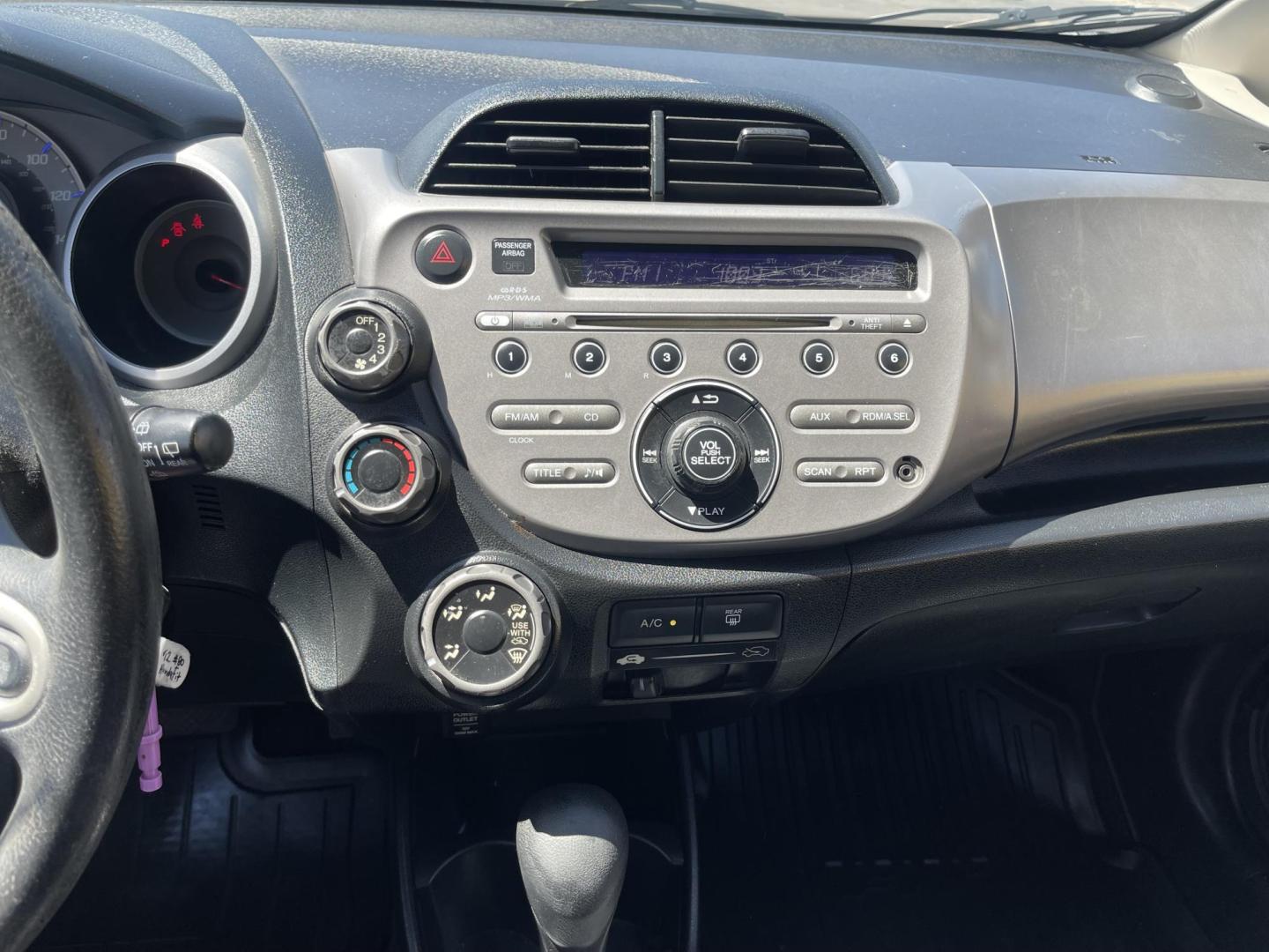 2012 Black /BLACK Honda Fit 5-Speed AT (JHMGE8H34CS) with an 1.5L L4 SOHC 16V engine, 5-Speed Automatic transmission, located at 801 South State Street, Salt Lake City, UT, 84111, (801) 328-0098, 40.751953, -111.888206 - Clean Title only 2 previous owners on the Carfax history report! Excellent gas mileage this 2012 Honda Fit gets up to 28 MPG city and 35 MPG highway!!! This is a must see for anyone looking for a nice affordable car!!! Features: Cloth Seats, ABS Brakes, AM/FM Stereo, Air Conditioning, Automatic Tra - Photo#14
