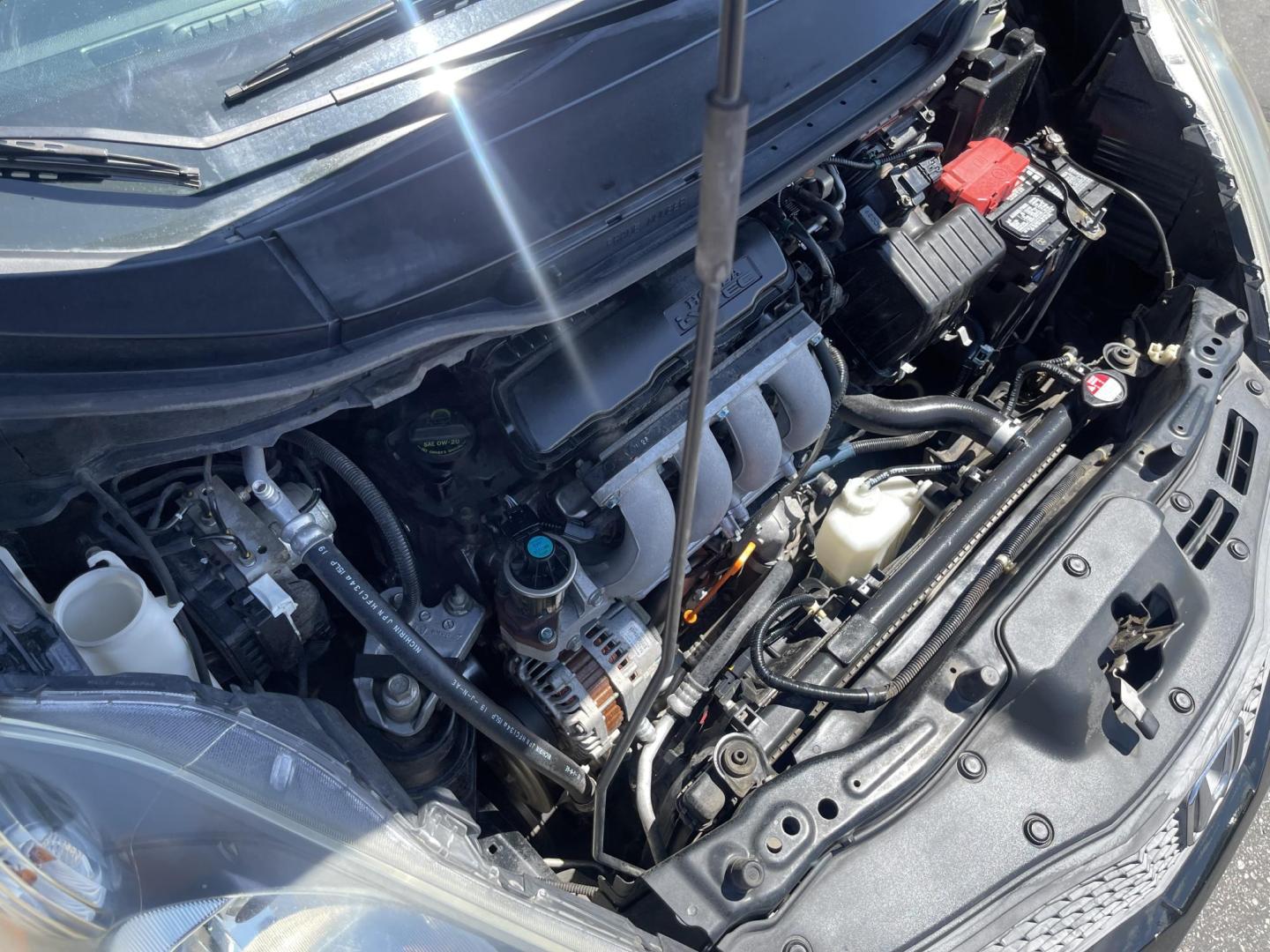 2012 Black /BLACK Honda Fit 5-Speed AT (JHMGE8H34CS) with an 1.5L L4 SOHC 16V engine, 5-Speed Automatic transmission, located at 801 South State Street, Salt Lake City, UT, 84111, (801) 328-0098, 40.751953, -111.888206 - Clean Title only 2 previous owners on the Carfax history report! Excellent gas mileage this 2012 Honda Fit gets up to 28 MPG city and 35 MPG highway!!! This is a must see for anyone looking for a nice affordable car!!! Features: Cloth Seats, ABS Brakes, AM/FM Stereo, Air Conditioning, Automatic Tra - Photo#22