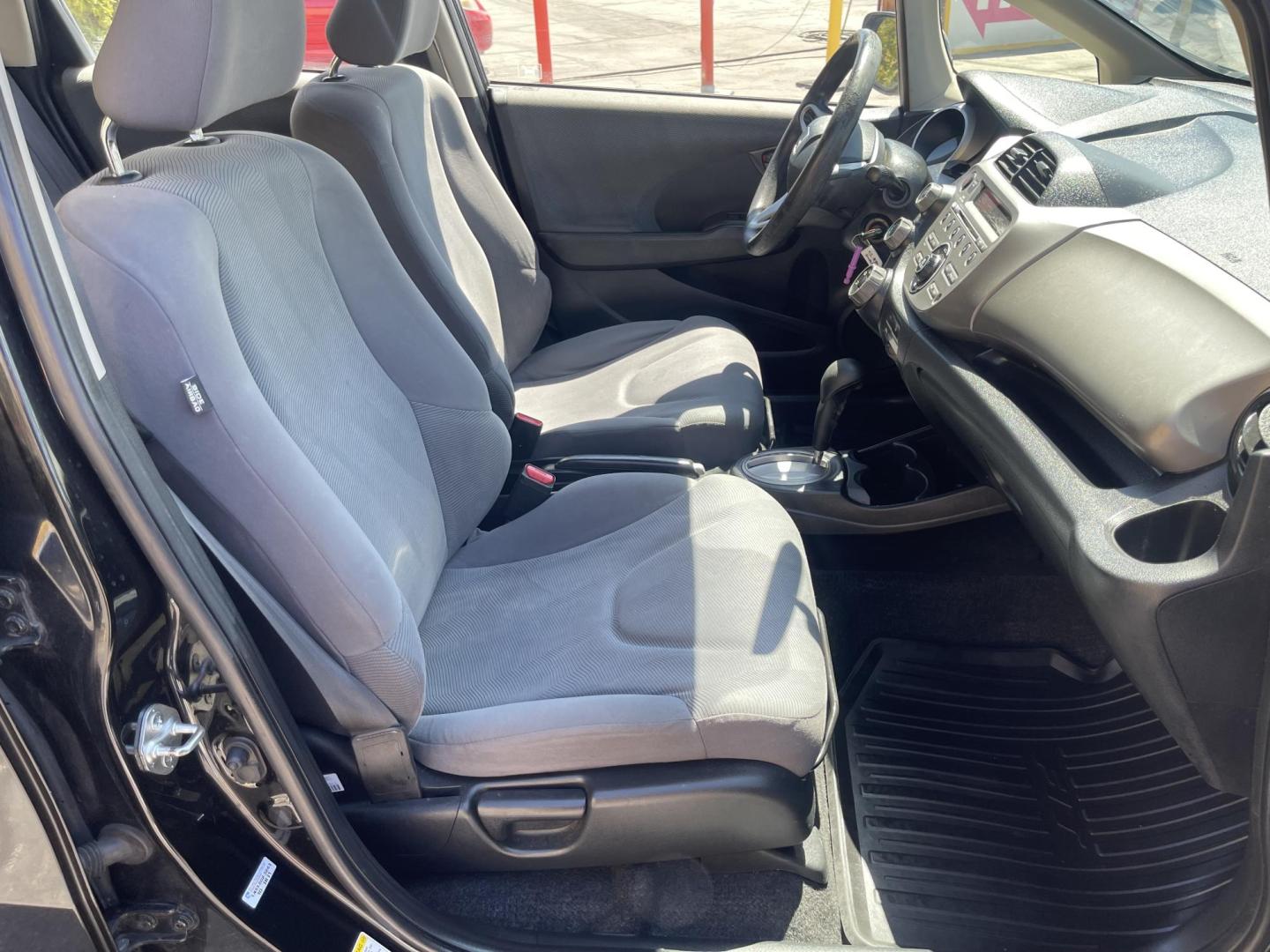 2012 Black /BLACK Honda Fit 5-Speed AT (JHMGE8H34CS) with an 1.5L L4 SOHC 16V engine, 5-Speed Automatic transmission, located at 801 South State Street, Salt Lake City, UT, 84111, (801) 328-0098, 40.751953, -111.888206 - Clean Title only 2 previous owners on the Carfax history report! Excellent gas mileage this 2012 Honda Fit gets up to 28 MPG city and 35 MPG highway!!! This is a must see for anyone looking for a nice affordable car!!! Features: Cloth Seats, ABS Brakes, AM/FM Stereo, Air Conditioning, Automatic Tra - Photo#25
