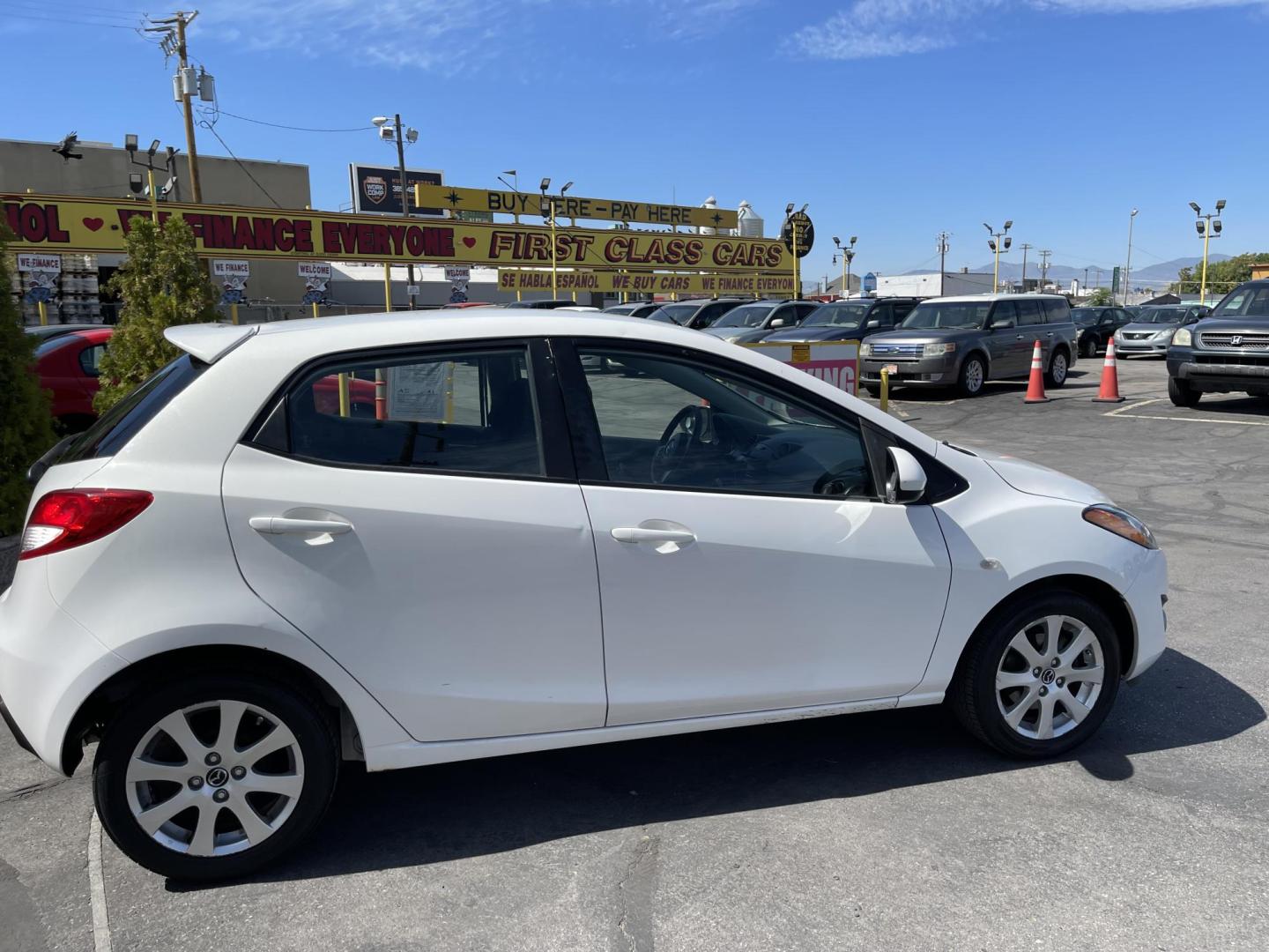 2013 Super White /BLACK Mazda MAZDA2 Touring (JM1DE1LZ7D0) with an 1.5L L4 DOHC 16V engine, Automatic transmission, located at 801 South State Street, Salt Lake City, UT, 84111, (801) 328-0098, 40.751953, -111.888206 - Clean Title!!! Good condition for the year, make and miles! Great gas mileage averaging 29 mpg in the city and 35 mpg on the highway! Approved for up to a 5 year warranty through Protective warranty company! Must see for anyone looking for clean reliable transportation and great gas mileage that wi - Photo#5