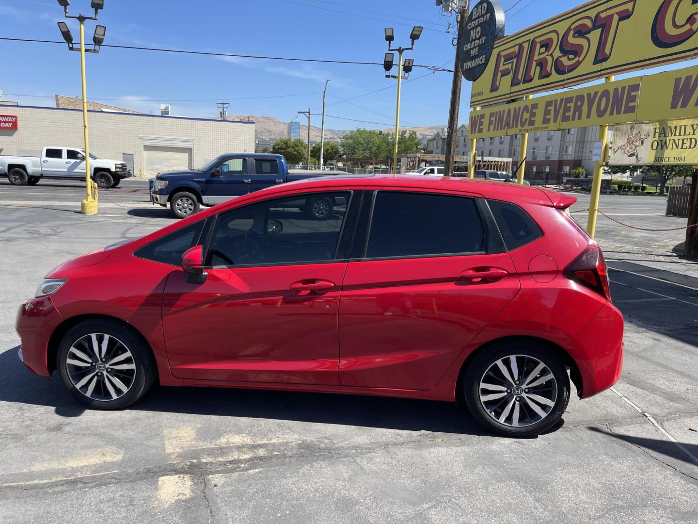 2016 Flame Red /BLACK Honda Fit EX CVT (JHMGK5H71GX) with an 1.5L L4 SOHC 16V engine, CVT transmission, located at 801 South State Street, Salt Lake City, UT, 84111, (801) 328-0098, 40.751953, -111.888206 - Clean title!!! This one is a must see in excellent condition for the year, make and miles! Has been cared for and serviced regularly as stated on the Carfax. Immaculate inside and out come see for yourself today! Great gas mileage this averages 33 MPG city / 41 MPG highway / 36 combined MPG impressi - Photo#8