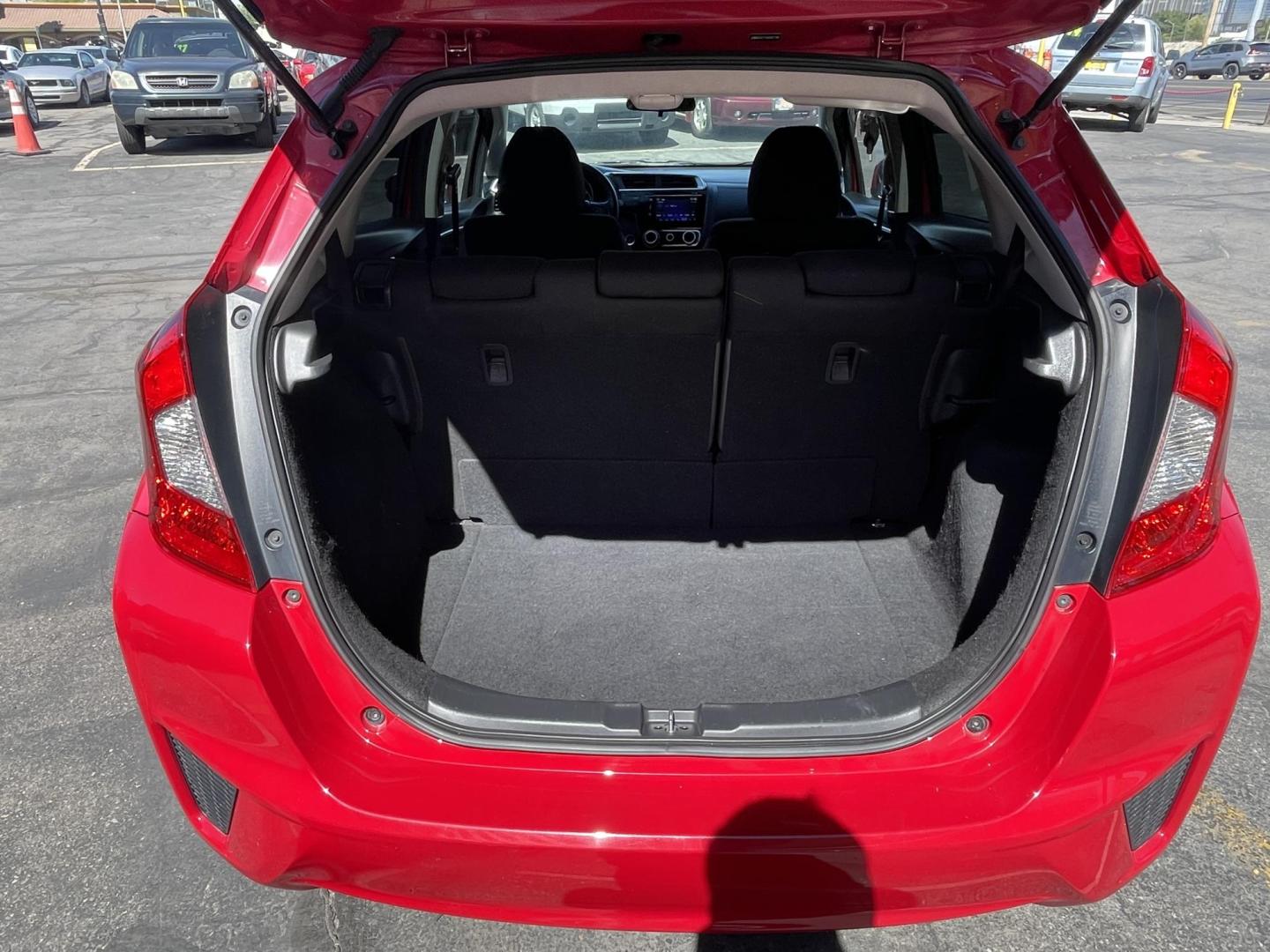 2016 Flame Red /BLACK Honda Fit EX CVT (JHMGK5H71GX) with an 1.5L L4 SOHC 16V engine, CVT transmission, located at 801 South State Street, Salt Lake City, UT, 84111, (801) 328-0098, 40.751953, -111.888206 - Clean title!!! This one is a must see in excellent condition for the year, make and miles! Has been cared for and serviced regularly as stated on the Carfax. Immaculate inside and out come see for yourself today! Great gas mileage this averages 33 MPG city / 41 MPG highway / 36 combined MPG impressi - Photo#31