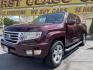 2013 Maroon /Tan Honda Ridgeline RTL w/ Leather and Navigation (5FPYK1F53DB) with an 3.5L V6 SOHC 24V engine, 5-Speed Automatic transmission, located at 801 South State Street, Salt Lake City, UT, 84111, (801) 328-0098, 40.751953, -111.888206 - Clean title! 4x4 in great condition! Bed liner is brand new and looks great we had a new bed liner installed! Truck has been through our mechanic shop and passed emissions already and approved for up to a 3 month to 5 year warranty that can be purchased! Very nice truck for anyone looking for a Ridg - Photo#1