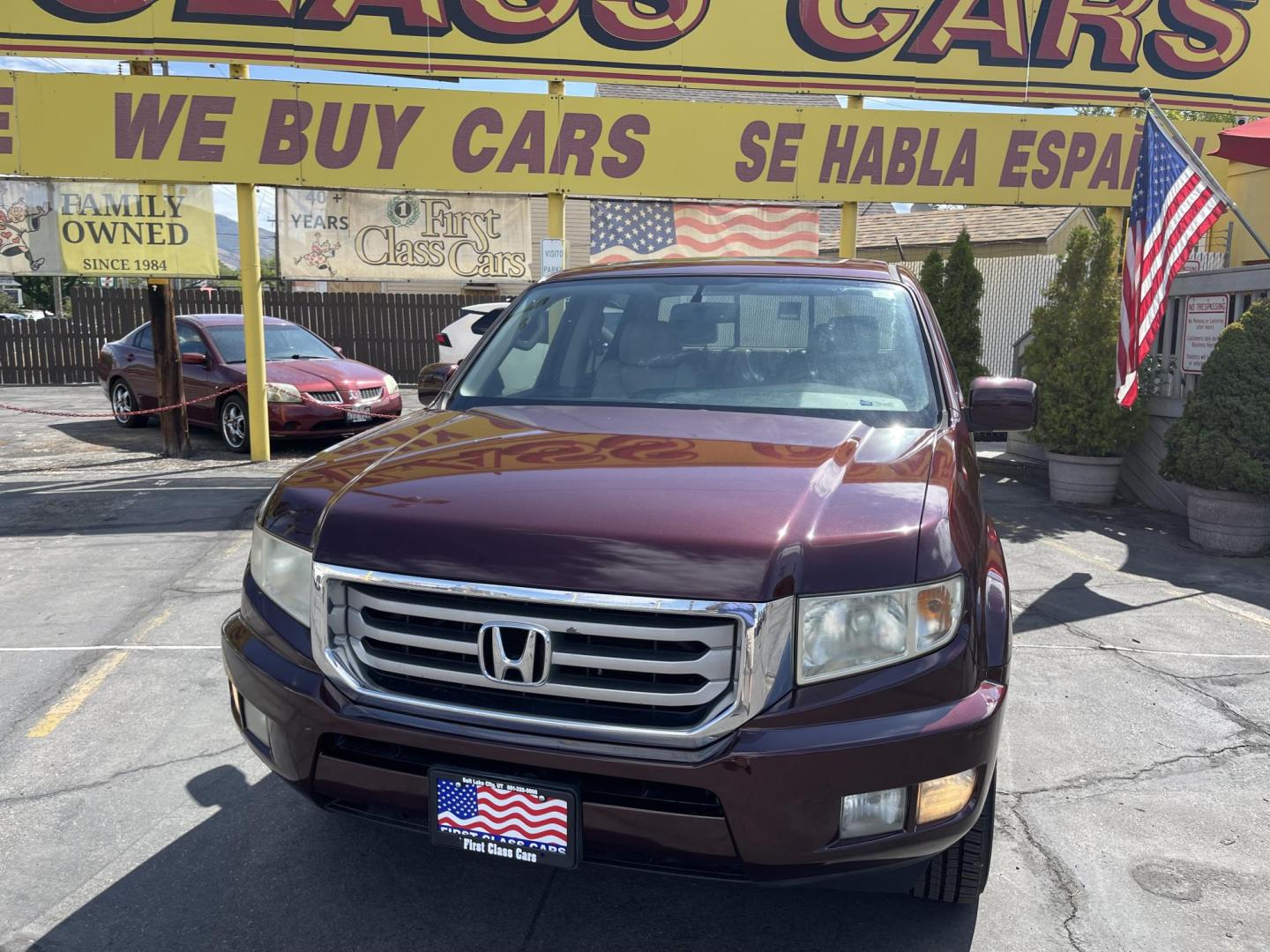 2013 Maroon /Tan Honda Ridgeline RTL w/ Leather and Navigation (5FPYK1F53DB) with an 3.5L V6 SOHC 24V engine, 5-Speed Automatic transmission, located at 801 South State Street, Salt Lake City, UT, 84111, (801) 328-0098, 40.751953, -111.888206 - Clean title! 4x4 in great condition! Bed liner is brand new and looks great we had a new bed liner installed! Truck has been through our mechanic shop and passed emissions already and approved for up to a 3 month to 5 year warranty that can be purchased! Very nice truck for anyone looking for a Ridg - Photo#2