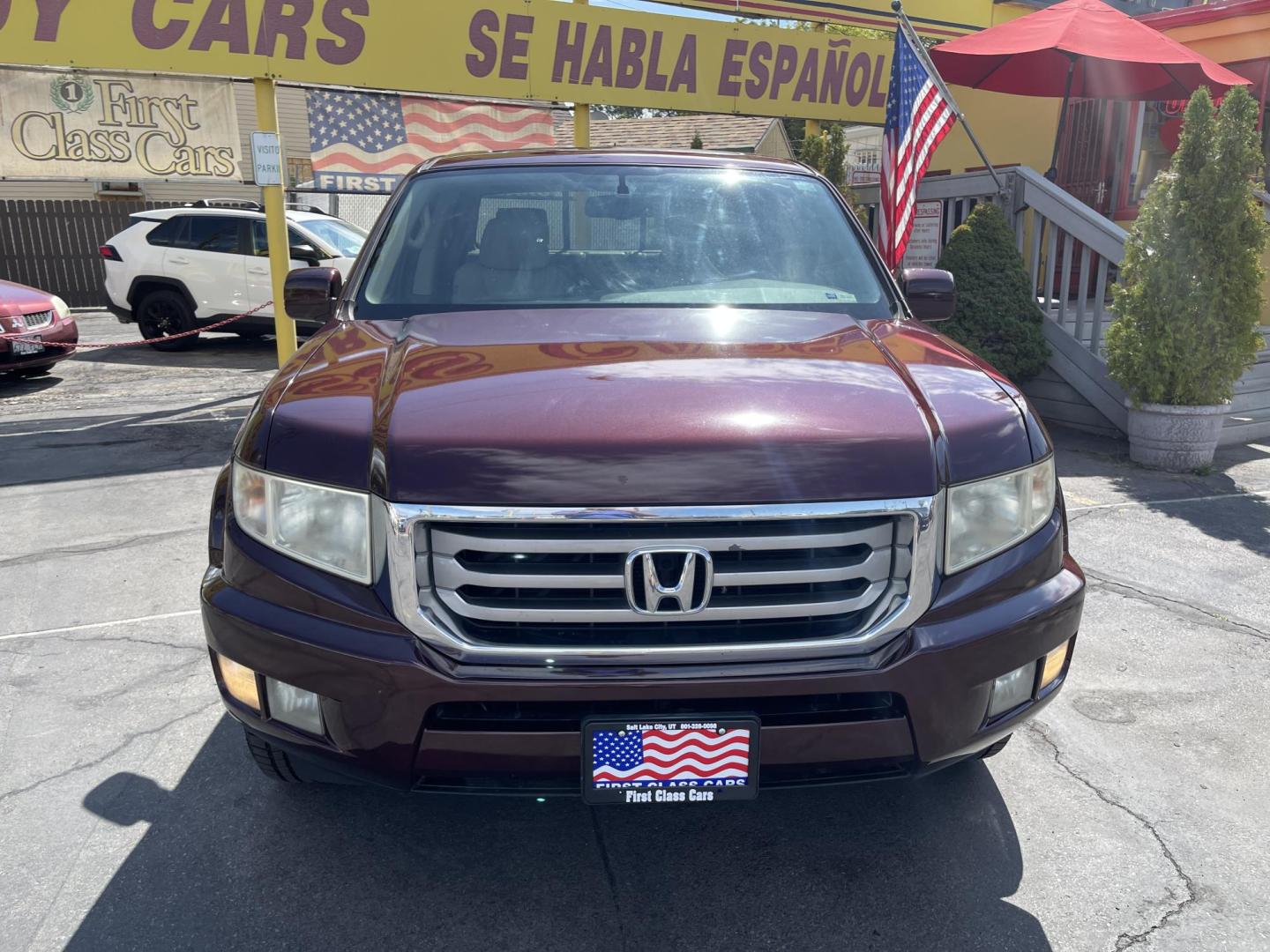 2013 Maroon /Tan Honda Ridgeline RTL w/ Leather and Navigation (5FPYK1F53DB) with an 3.5L V6 SOHC 24V engine, 5-Speed Automatic transmission, located at 801 South State Street, Salt Lake City, UT, 84111, (801) 328-0098, 40.751953, -111.888206 - Clean title! 4x4 in great condition! Bed liner is brand new and looks great we had a new bed liner installed! Truck has been through our mechanic shop and passed emissions already and approved for up to a 3 month to 5 year warranty that can be purchased! Very nice truck for anyone looking for a Ridg - Photo#3