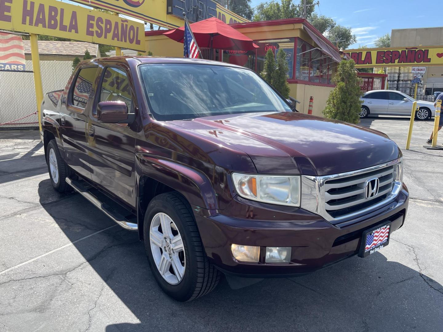 2013 Maroon /Tan Honda Ridgeline RTL w/ Leather and Navigation (5FPYK1F53DB) with an 3.5L V6 SOHC 24V engine, 5-Speed Automatic transmission, located at 801 South State Street, Salt Lake City, UT, 84111, (801) 328-0098, 40.751953, -111.888206 - Clean title! 4x4 in great condition! Bed liner is brand new and looks great we had a new bed liner installed! Truck has been through our mechanic shop and passed emissions already and approved for up to a 3 month to 5 year warranty that can be purchased! Very nice truck for anyone looking for a Ridg - Photo#4