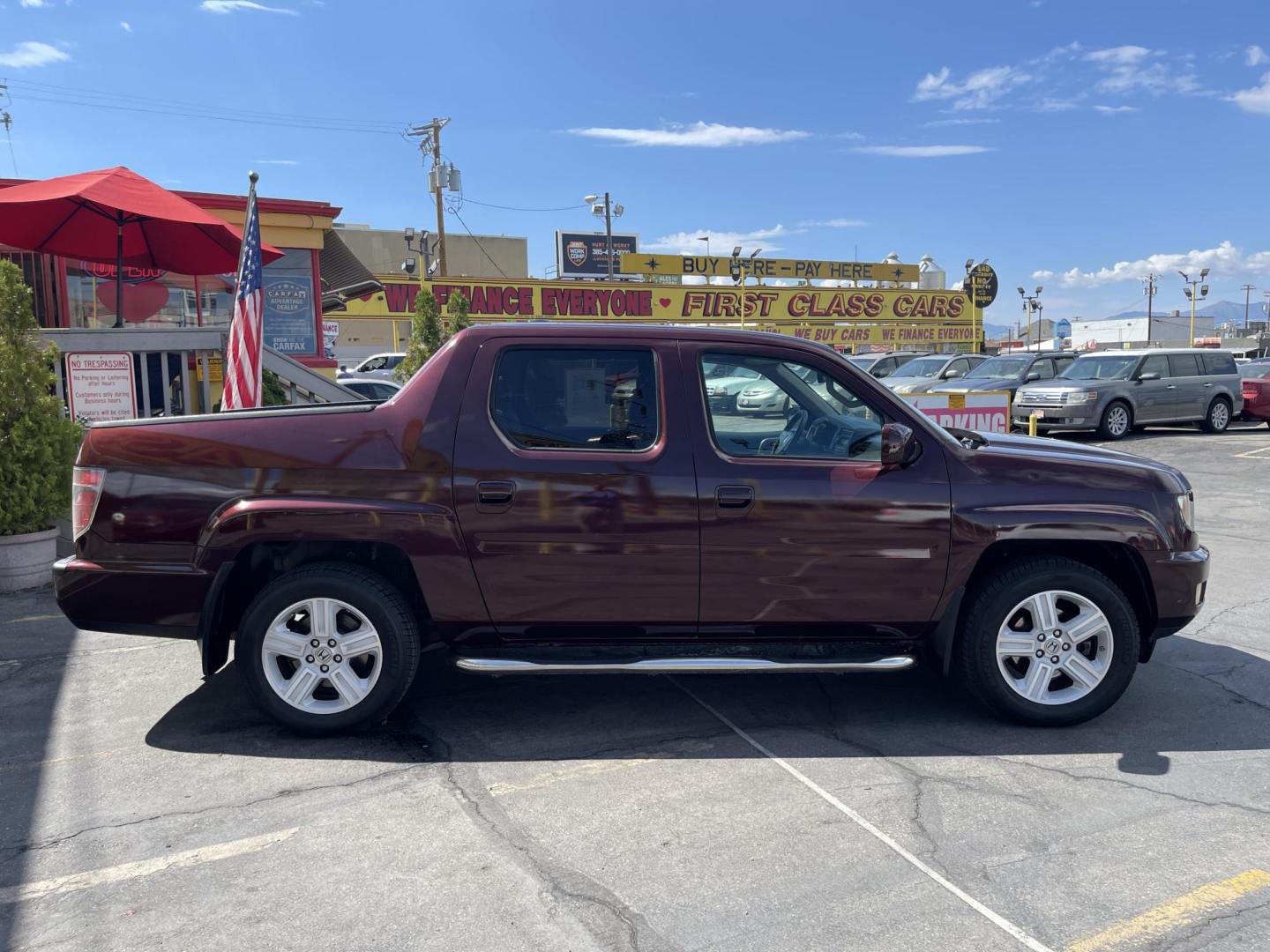 2013 Maroon /Tan Honda Ridgeline RTL w/ Leather and Navigation (5FPYK1F53DB) with an 3.5L V6 SOHC 24V engine, 5-Speed Automatic transmission, located at 801 South State Street, Salt Lake City, UT, 84111, (801) 328-0098, 40.751953, -111.888206 - Clean title! 4x4 in great condition! Bed liner is brand new and looks great we had a new bed liner installed! Truck has been through our mechanic shop and passed emissions already and approved for up to a 3 month to 5 year warranty that can be purchased! Very nice truck for anyone looking for a Ridg - Photo#6