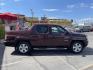 2013 Maroon /Tan Honda Ridgeline RTL w/ Leather and Navigation (5FPYK1F53DB) with an 3.5L V6 SOHC 24V engine, 5-Speed Automatic transmission, located at 801 South State Street, Salt Lake City, UT, 84111, (801) 328-0098, 40.751953, -111.888206 - Clean title! 4x4 in great condition! Bed liner is brand new and looks great we had a new bed liner installed! Truck has been through our mechanic shop and passed emissions already and approved for up to a 3 month to 5 year warranty that can be purchased! Very nice truck for anyone looking for a Ridg - Photo#6