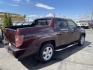 2013 Maroon /Tan Honda Ridgeline RTL w/ Leather and Navigation (5FPYK1F53DB) with an 3.5L V6 SOHC 24V engine, 5-Speed Automatic transmission, located at 801 South State Street, Salt Lake City, UT, 84111, (801) 328-0098, 40.751953, -111.888206 - Clean title! 4x4 in great condition! Bed liner is brand new and looks great we had a new bed liner installed! Truck has been through our mechanic shop and passed emissions already and approved for up to a 3 month to 5 year warranty that can be purchased! Very nice truck for anyone looking for a Ridg - Photo#7