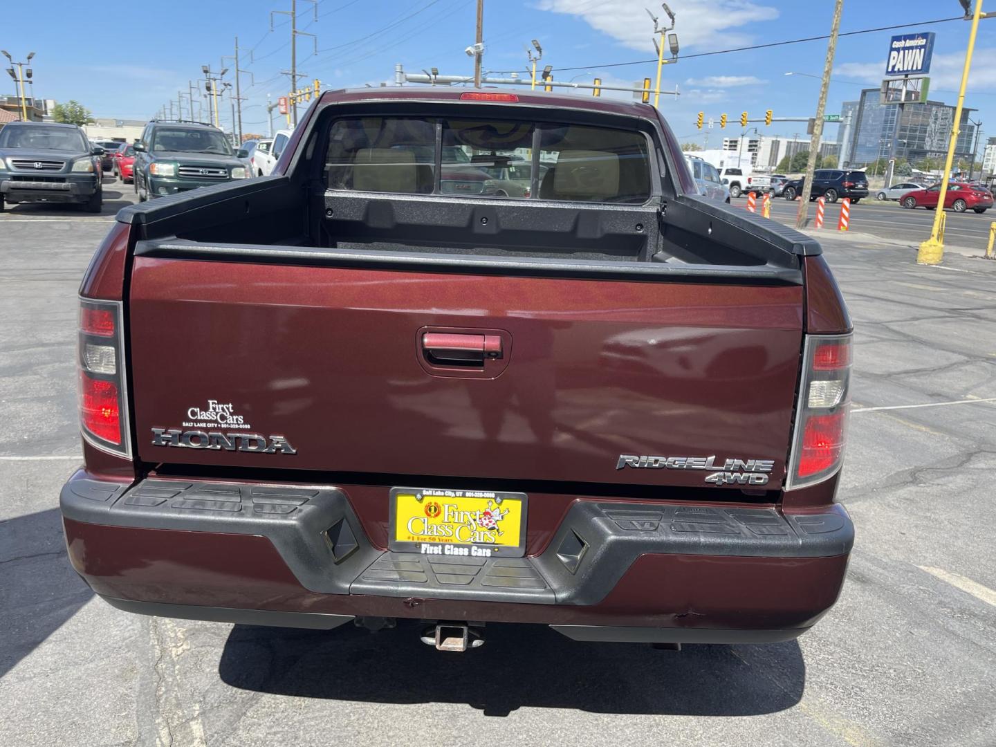 2013 Maroon /Tan Honda Ridgeline RTL w/ Leather and Navigation (5FPYK1F53DB) with an 3.5L V6 SOHC 24V engine, 5-Speed Automatic transmission, located at 801 South State Street, Salt Lake City, UT, 84111, (801) 328-0098, 40.751953, -111.888206 - Clean title! 4x4 in great condition! Bed liner is brand new and looks great we had a new bed liner installed! Truck has been through our mechanic shop and passed emissions already and approved for up to a 3 month to 5 year warranty that can be purchased! Very nice truck for anyone looking for a Ridg - Photo#8