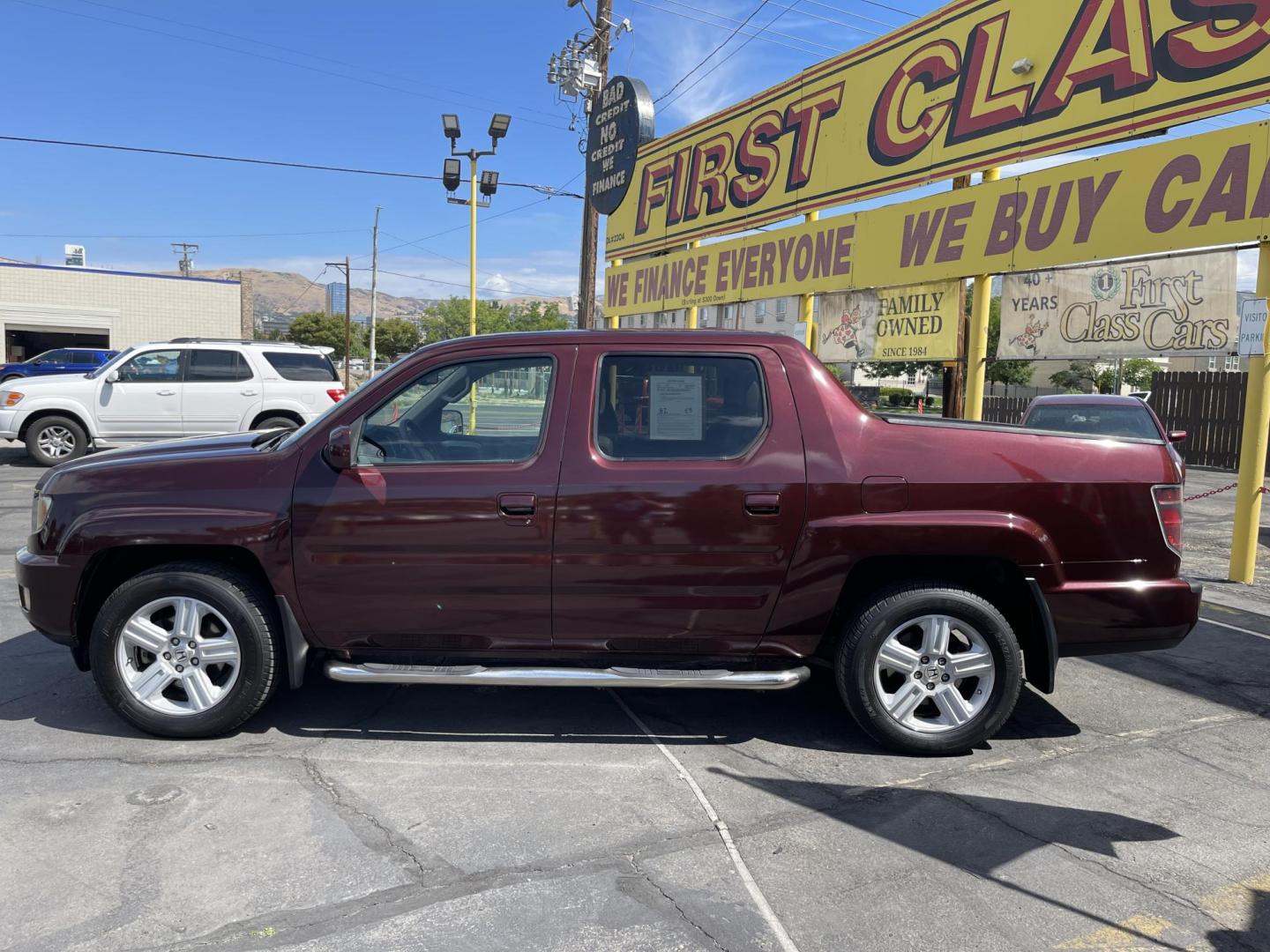 2013 Maroon /Tan Honda Ridgeline RTL w/ Leather and Navigation (5FPYK1F53DB) with an 3.5L V6 SOHC 24V engine, 5-Speed Automatic transmission, located at 801 South State Street, Salt Lake City, UT, 84111, (801) 328-0098, 40.751953, -111.888206 - Clean title! 4x4 in great condition! Bed liner is brand new and looks great we had a new bed liner installed! Truck has been through our mechanic shop and passed emissions already and approved for up to a 3 month to 5 year warranty that can be purchased! Very nice truck for anyone looking for a Ridg - Photo#10