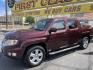 2013 Maroon /Tan Honda Ridgeline RTL w/ Leather and Navigation (5FPYK1F53DB) with an 3.5L V6 SOHC 24V engine, 5-Speed Automatic transmission, located at 801 South State Street, Salt Lake City, UT, 84111, (801) 328-0098, 40.751953, -111.888206 - Clean title! 4x4 in great condition! Bed liner is brand new and looks great we had a new bed liner installed! Truck has been through our mechanic shop and passed emissions already and approved for up to a 3 month to 5 year warranty that can be purchased! Very nice truck for anyone looking for a Ridg - Photo#11