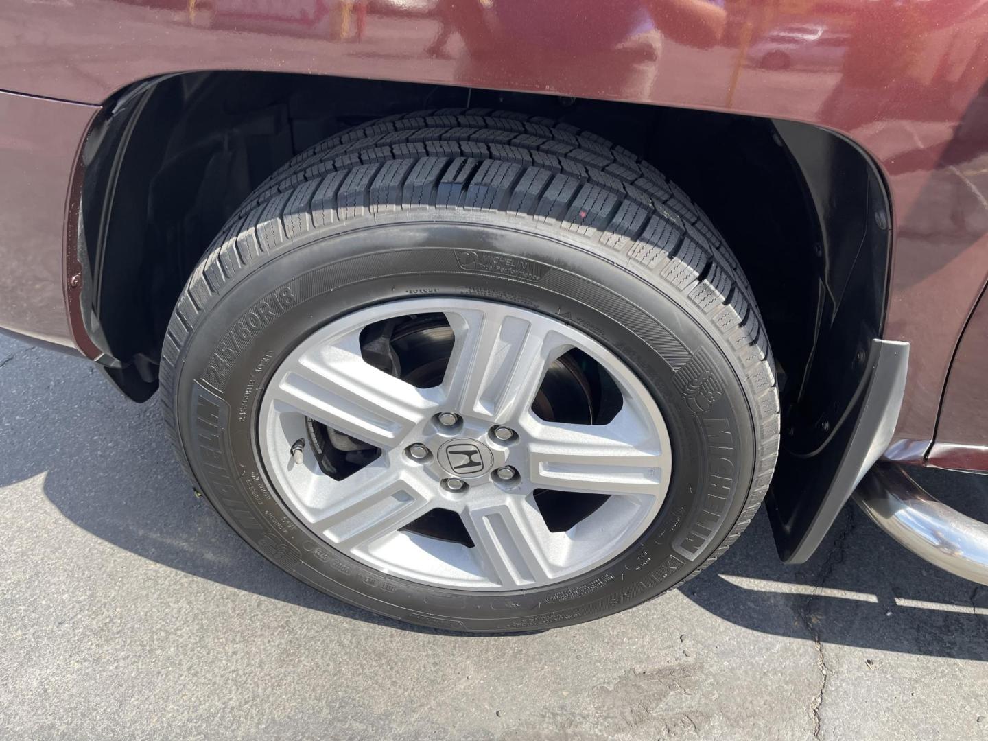 2013 Maroon /Tan Honda Ridgeline RTL w/ Leather and Navigation (5FPYK1F53DB) with an 3.5L V6 SOHC 24V engine, 5-Speed Automatic transmission, located at 801 South State Street, Salt Lake City, UT, 84111, (801) 328-0098, 40.751953, -111.888206 - Clean title! 4x4 in great condition! Bed liner is brand new and looks great we had a new bed liner installed! Truck has been through our mechanic shop and passed emissions already and approved for up to a 3 month to 5 year warranty that can be purchased! Very nice truck for anyone looking for a Ridg - Photo#12