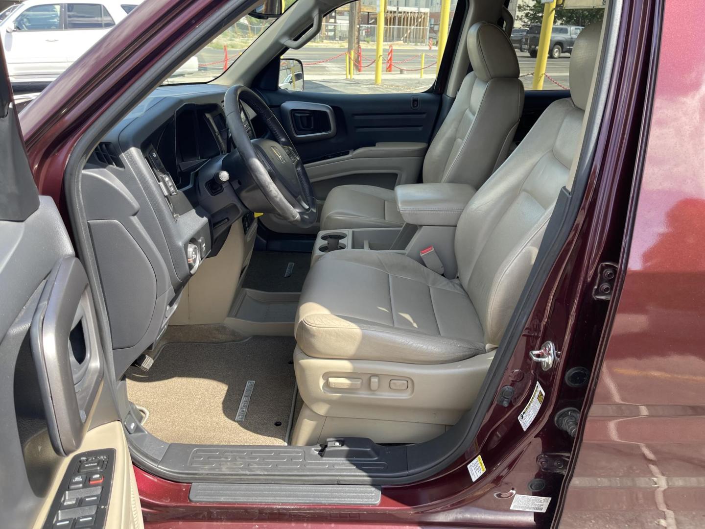 2013 Maroon /Tan Honda Ridgeline RTL w/ Leather and Navigation (5FPYK1F53DB) with an 3.5L V6 SOHC 24V engine, 5-Speed Automatic transmission, located at 801 South State Street, Salt Lake City, UT, 84111, (801) 328-0098, 40.751953, -111.888206 - Clean title! 4x4 in great condition! Bed liner is brand new and looks great we had a new bed liner installed! Truck has been through our mechanic shop and passed emissions already and approved for up to a 3 month to 5 year warranty that can be purchased! Very nice truck for anyone looking for a Ridg - Photo#14