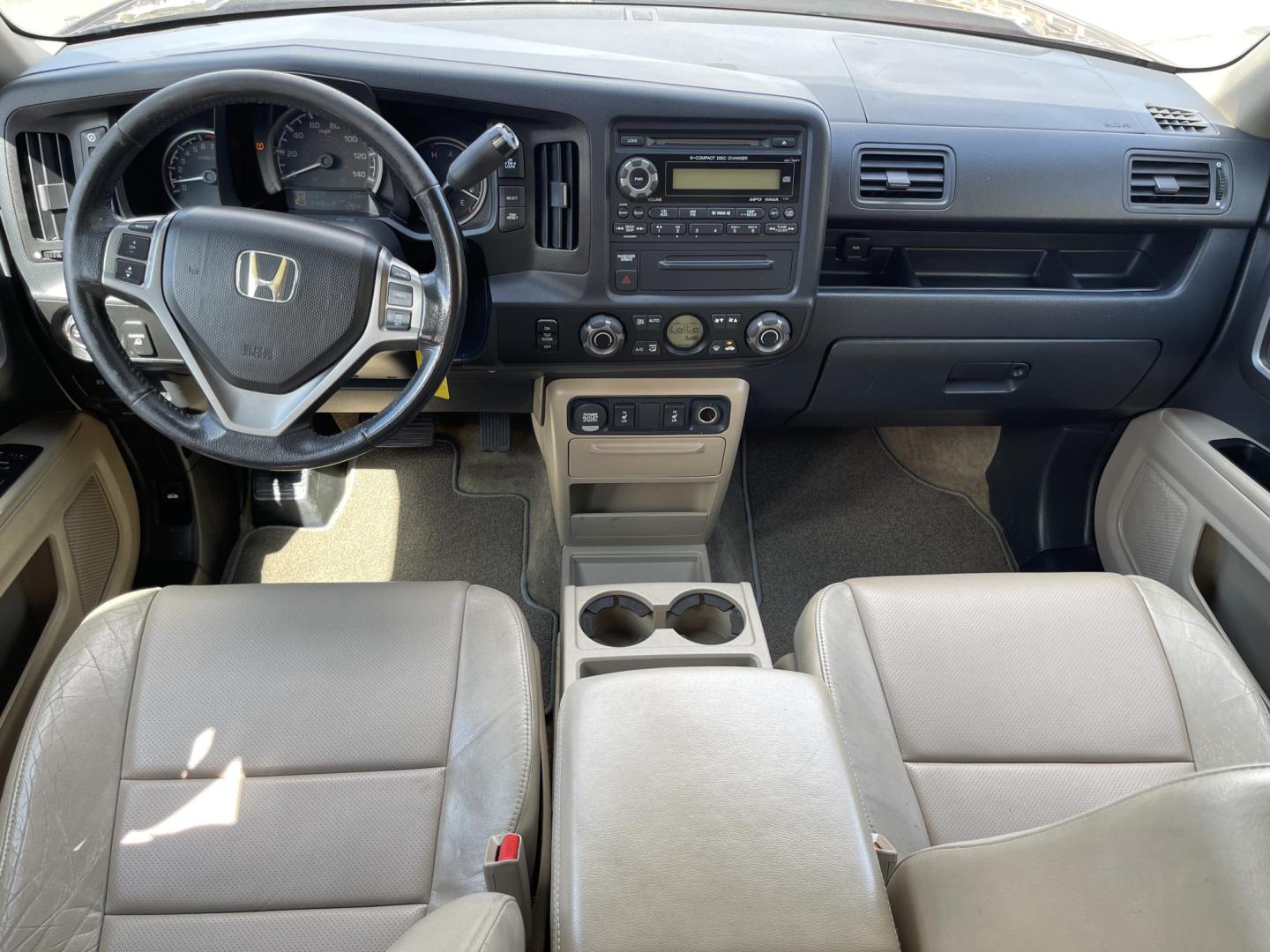 2013 Maroon /Tan Honda Ridgeline RTL w/ Leather and Navigation (5FPYK1F53DB) with an 3.5L V6 SOHC 24V engine, 5-Speed Automatic transmission, located at 801 South State Street, Salt Lake City, UT, 84111, (801) 328-0098, 40.751953, -111.888206 - Clean title! 4x4 in great condition! Bed liner is brand new and looks great we had a new bed liner installed! Truck has been through our mechanic shop and passed emissions already and approved for up to a 3 month to 5 year warranty that can be purchased! Very nice truck for anyone looking for a Ridg - Photo#16
