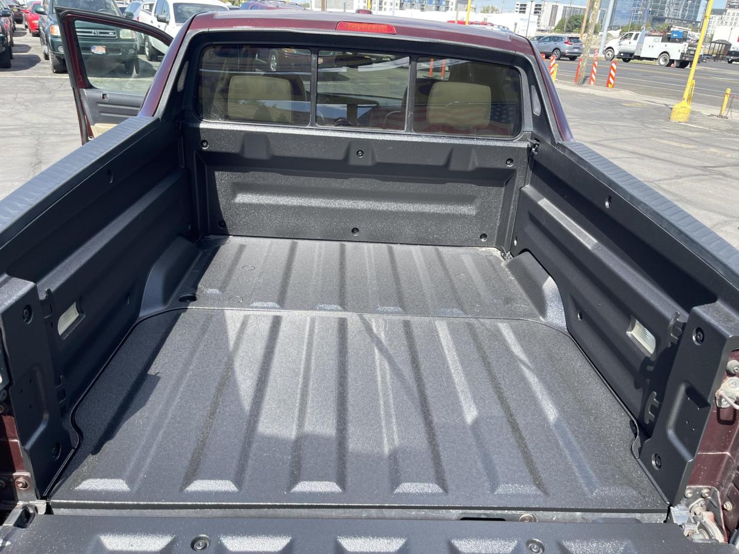 2013 Maroon /Tan Honda Ridgeline RTL w/ Leather and Navigation (5FPYK1F53DB) with an 3.5L V6 SOHC 24V engine, 5-Speed Automatic transmission, located at 801 South State Street, Salt Lake City, UT, 84111, (801) 328-0098, 40.751953, -111.888206 - Clean title! 4x4 in great condition! Bed liner is brand new and looks great we had a new bed liner installed! Truck has been through our mechanic shop and passed emissions already and approved for up to a 3 month to 5 year warranty that can be purchased! Very nice truck for anyone looking for a Ridg - Photo#24