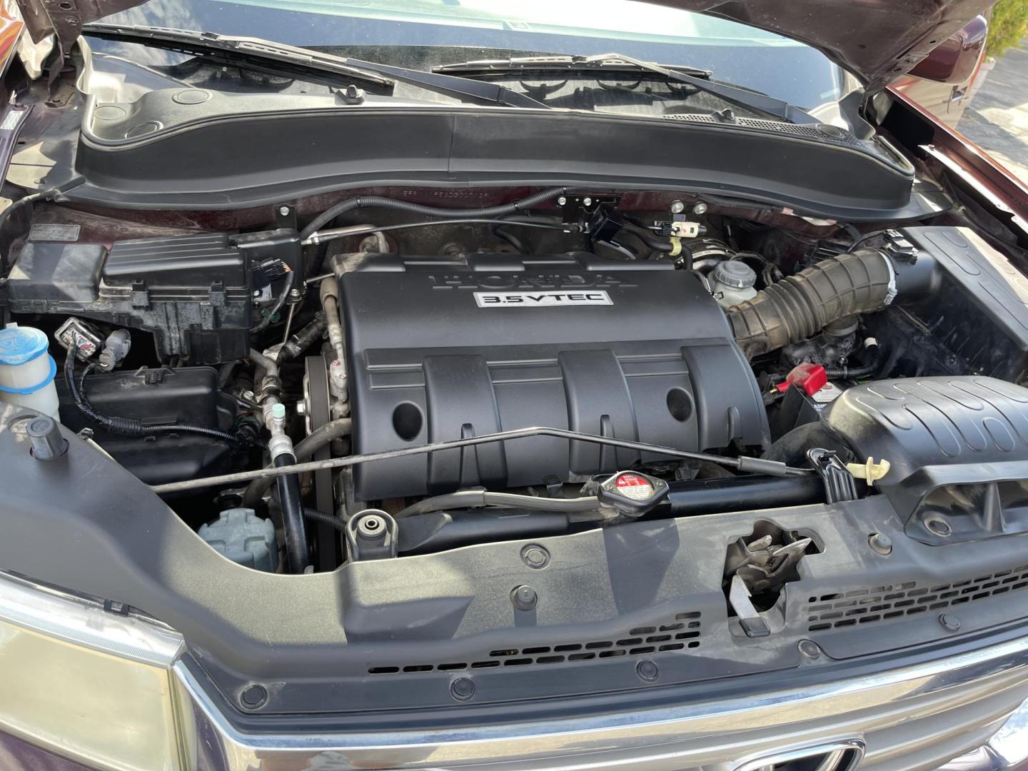 2013 Maroon /Tan Honda Ridgeline RTL w/ Leather and Navigation (5FPYK1F53DB) with an 3.5L V6 SOHC 24V engine, 5-Speed Automatic transmission, located at 801 South State Street, Salt Lake City, UT, 84111, (801) 328-0098, 40.751953, -111.888206 - Clean title! 4x4 in great condition! Bed liner is brand new and looks great we had a new bed liner installed! Truck has been through our mechanic shop and passed emissions already and approved for up to a 3 month to 5 year warranty that can be purchased! Very nice truck for anyone looking for a Ridg - Photo#27