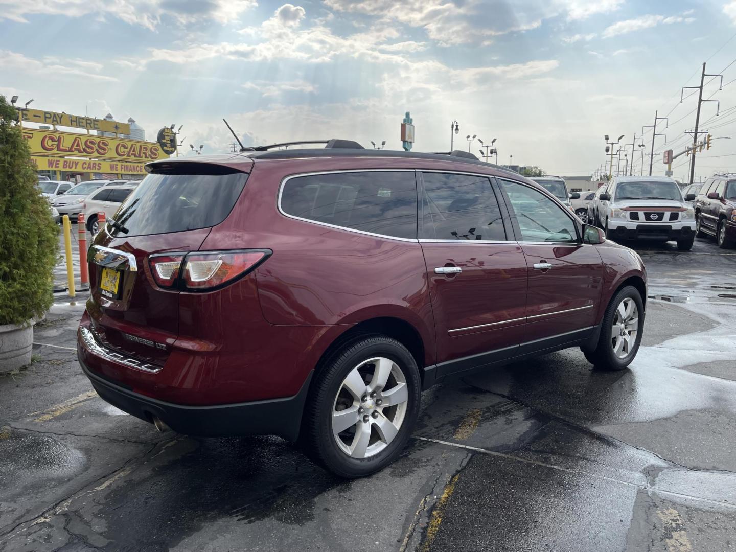 2015 Maroon /Black Chevrolet Traverse LTZ AWD (1GNKVJKD0FJ) with an 3.6L V6 DOHC 24V engine, 6-Speed Automatic transmission, located at 801 South State Street, Salt Lake City, UT, 84111, (801) 328-0098, 40.751953, -111.888206 - AWD, Clean title!!! Must see in great condition for the year, make and miles! Comes with all wheel drive and is loaded with lots of adds. Equipped with rear entertainment and rear a/c ventilation, 3rd row seating for the family great family vehicle! Heated and A/C seats! Vehicle has been inspected b - Photo#5