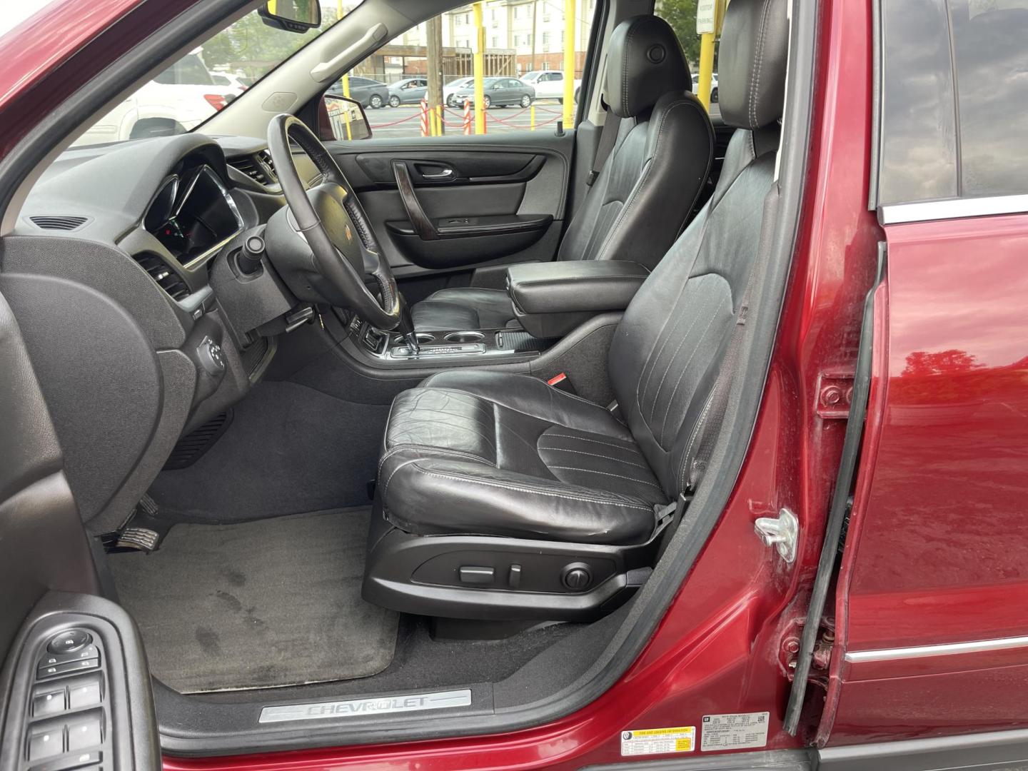 2015 Maroon /Black Chevrolet Traverse LTZ AWD (1GNKVJKD0FJ) with an 3.6L V6 DOHC 24V engine, 6-Speed Automatic transmission, located at 801 South State Street, Salt Lake City, UT, 84111, (801) 328-0098, 40.751953, -111.888206 - AWD, Clean title!!! Must see in great condition for the year, make and miles! Comes with all wheel drive and is loaded with lots of adds. Equipped with rear entertainment and rear a/c ventilation, 3rd row seating for the family great family vehicle! Heated and A/C seats! Vehicle has been inspected b - Photo#12