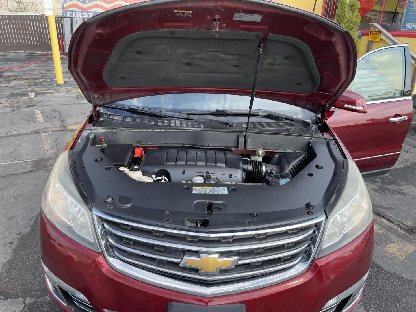 2015 Maroon /Black Chevrolet Traverse LTZ AWD (1GNKVJKD0FJ) with an 3.6L V6 DOHC 24V engine, 6-Speed Automatic transmission, located at 801 South State Street, Salt Lake City, UT, 84111, (801) 328-0098, 40.751953, -111.888206 - AWD, Clean title!!! Must see in great condition for the year, make and miles! Comes with all wheel drive and is loaded with lots of adds. Equipped with rear entertainment and rear a/c ventilation, 3rd row seating for the family great family vehicle! Heated and A/C seats! Vehicle has been inspected b - Photo#29