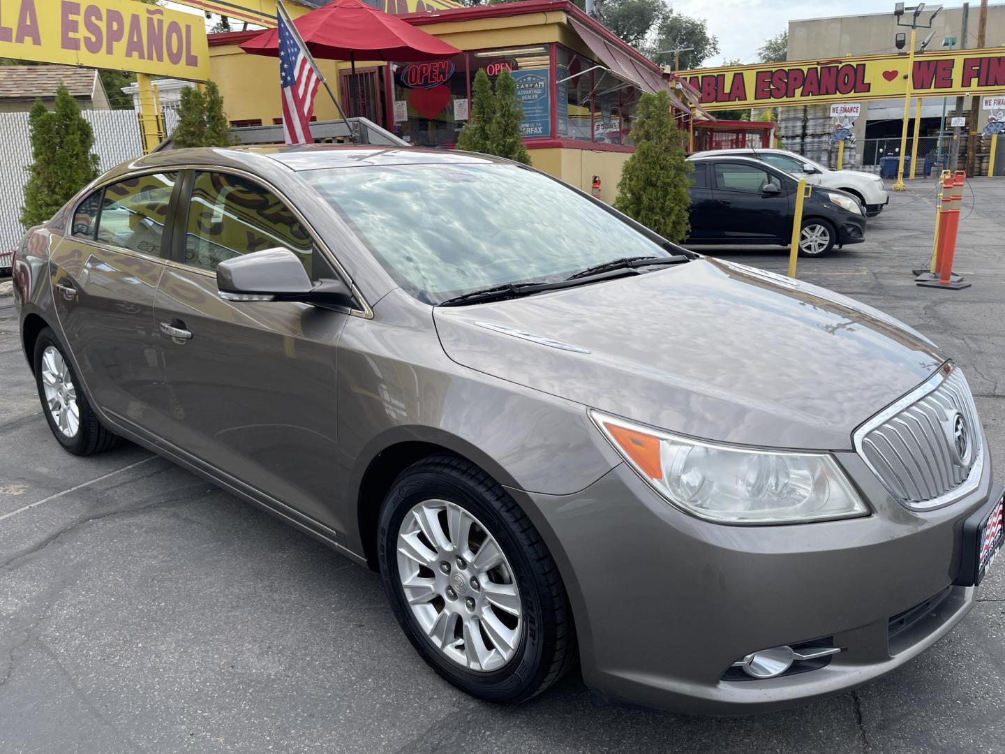 2012 Silver Sky Metallic /Tan Buick LaCrosse Leather Package (1G4GC5ER8CF) with an 2.4L L4 DOHC 16V engine, 6-Speed Automatic transmission, located at 801 South State Street, Salt Lake City, UT, 84111, (801) 328-0098, 40.751953, -111.888206 - Clean title! No accidents on Carfax! Service history is shown on the Carfax report. Super clean inside and out! Immaculate condition! Passed emissions already and has been checked out by our mechanic shop and approved for up to a 5 year warranty. Features: ABS Brakes, Air Conditioning, Alloy Wheels - Photo#3