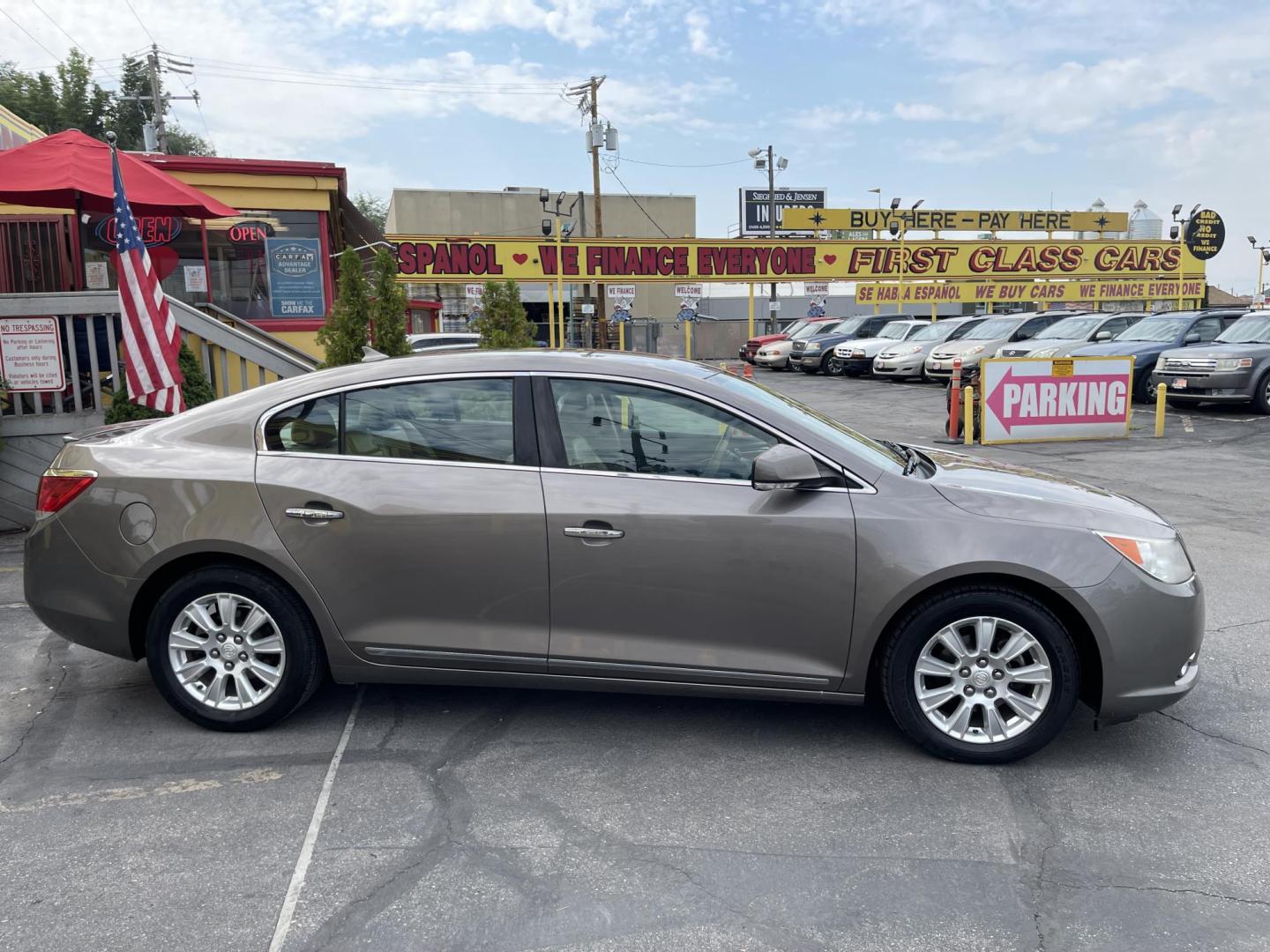 2012 Silver Sky Metallic /Tan Buick LaCrosse Leather Package (1G4GC5ER8CF) with an 2.4L L4 DOHC 16V engine, 6-Speed Automatic transmission, located at 801 South State Street, Salt Lake City, UT, 84111, (801) 328-0098, 40.751953, -111.888206 - Clean title! No accidents on Carfax! Service history is shown on the Carfax report. Super clean inside and out! Immaculate condition! Passed emissions already and has been checked out by our mechanic shop and approved for up to a 5 year warranty. Features: ABS Brakes, Air Conditioning, Alloy Wheels - Photo#4