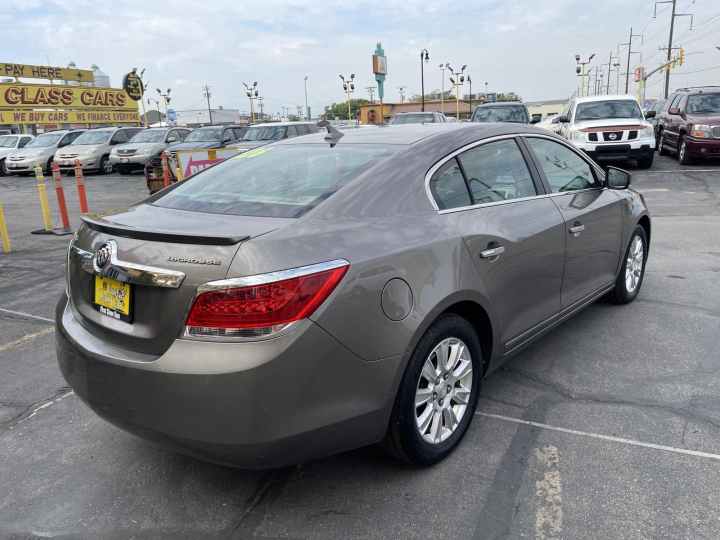 2012 Silver Sky Metallic /Tan Buick LaCrosse Leather Package (1G4GC5ER8CF) with an 2.4L L4 DOHC 16V engine, 6-Speed Automatic transmission, located at 801 South State Street, Salt Lake City, UT, 84111, (801) 328-0098, 40.751953, -111.888206 - Clean title! No accidents on Carfax! Service history is shown on the Carfax report. Super clean inside and out! Immaculate condition! Passed emissions already and has been checked out by our mechanic shop and approved for up to a 5 year warranty. Features: ABS Brakes, Air Conditioning, Alloy Wheels - Photo#5