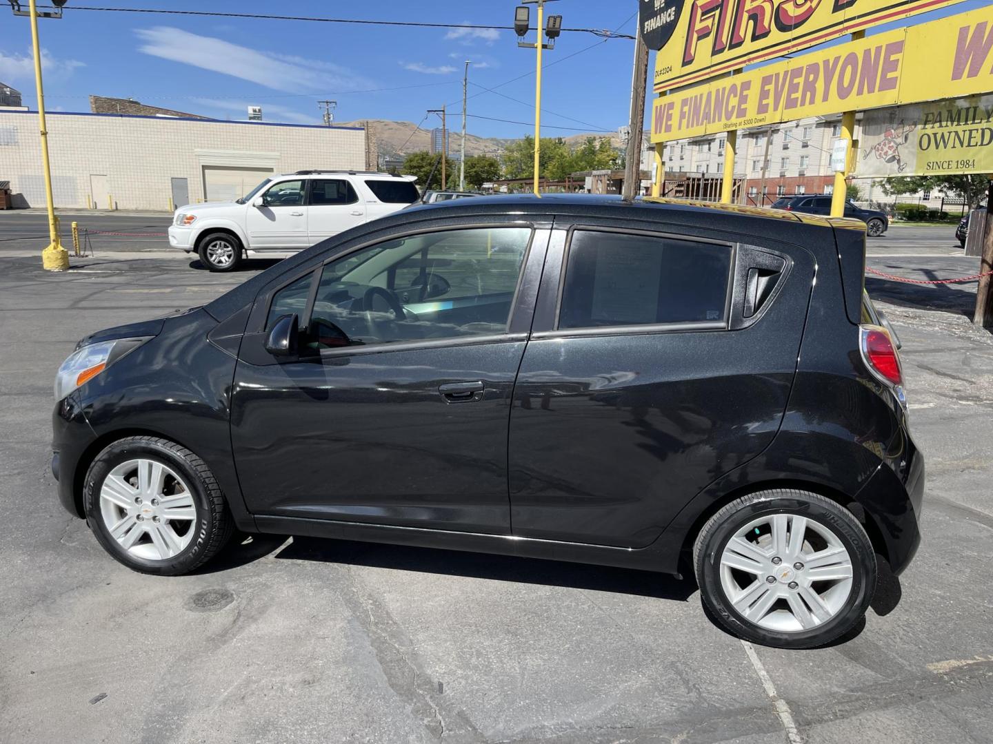 2013 Black /Black Chevrolet Spark LS Auto (KL8CB6S90DC) with an 1.2L L4 16V DOHC engine, 4-Speed Automatic transmission, located at 801 South State Street, Salt Lake City, UT, 84111, (801) 328-0098, 40.751953, -111.888206 - Clean title! Great gas saver! Low miles! Hard to find this clean with low miles at an affordable price range! Has been approved for up to a 5 year bumper to bumper warranty that can be purchased anywhere from 3 months up to 5 years for a powertrain warranty. Features: ABS Brakes, Air Conditioning, - Photo#9
