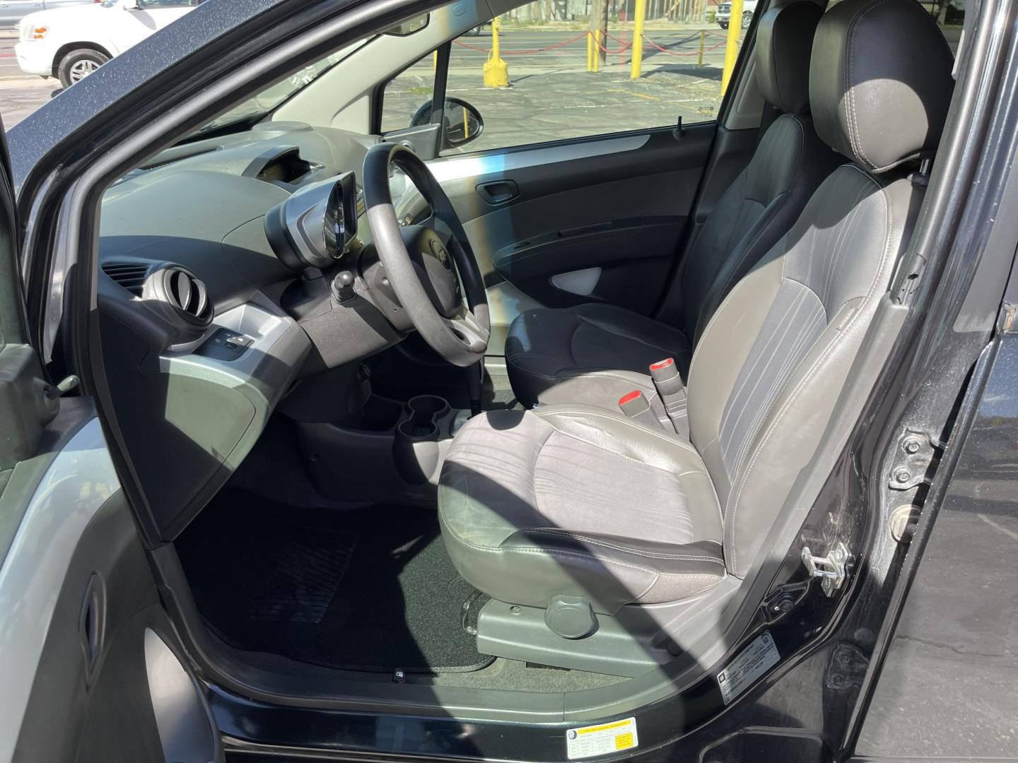 2013 Black /Black Chevrolet Spark LS Auto (KL8CB6S90DC) with an 1.2L L4 16V DOHC engine, 4-Speed Automatic transmission, located at 801 South State Street, Salt Lake City, UT, 84111, (801) 328-0098, 40.751953, -111.888206 - Clean title! Great gas saver! Low miles! Hard to find this clean with low miles at an affordable price range! Has been approved for up to a 5 year bumper to bumper warranty that can be purchased anywhere from 3 months up to 5 years for a powertrain warranty. Features: ABS Brakes, Air Conditioning, - Photo#12
