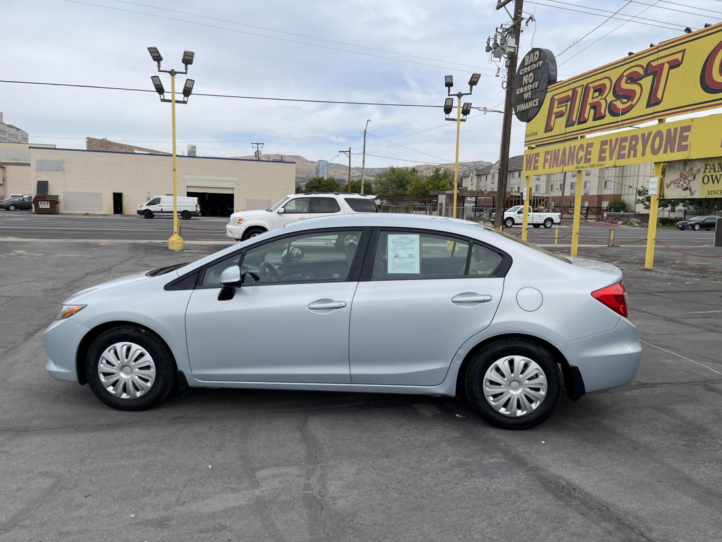2012 Satin Silver Metallic /Gray Honda Civic LX Sedan 5-Speed AT (19XFB2F5XCE) with an 1.8L L4 SOHC 16V engine, 5-Speed Automatic transmission, located at 801 South State Street, Salt Lake City, UT, 84111, (801) 328-0098, 40.751953, -111.888206 - Clean title!!! No accidents on Carfax history report! Vehicle has been very well taken care of and maintained Carfax shows this vehicle has been serviced 25 times that includes oil changes and regular maintenance that has been performed. Great gas saver this 2012 Honda Civic LX with a 1.8L engine g - Photo#8
