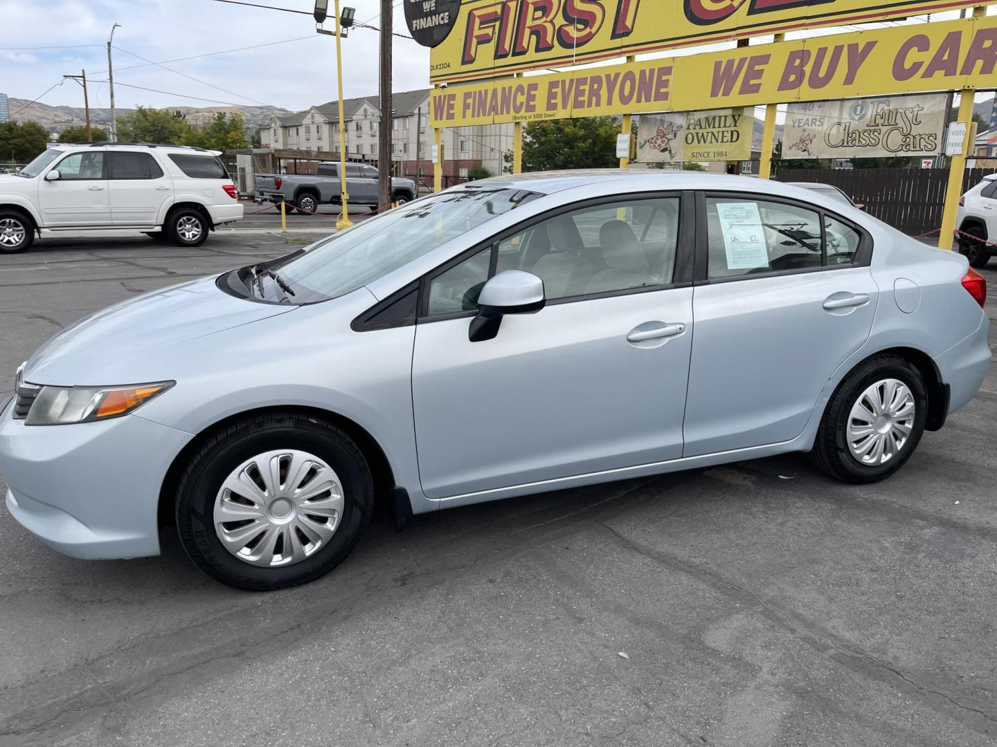 2012 Satin Silver Metallic /Gray Honda Civic LX Sedan 5-Speed AT (19XFB2F5XCE) with an 1.8L L4 SOHC 16V engine, 5-Speed Automatic transmission, located at 801 South State Street, Salt Lake City, UT, 84111, (801) 328-0098, 40.751953, -111.888206 - Clean title!!! No accidents on Carfax history report! Vehicle has been very well taken care of and maintained Carfax shows this vehicle has been serviced 25 times that includes oil changes and regular maintenance that has been performed. Great gas saver this 2012 Honda Civic LX with a 1.8L engine g - Photo#9