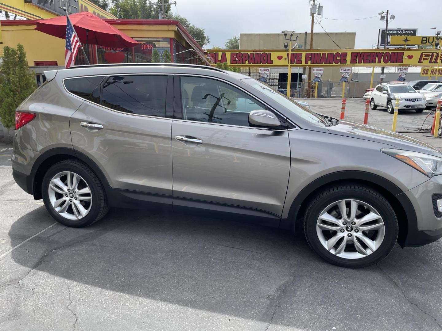 2013 Bamboo Pearl /Black Hyundai Santa Fe Sport 2.0 AWD (5XYZUDLA9DG) with an 2.0L L4 DOHC 16V engine, 6-Speed Automatic transmission, located at 801 South State Street, Salt Lake City, UT, 84111, (801) 328-0098, 40.751953, -111.888206 - Clean title no accidents!!! Super clean with very low miles only 67k miles very clean hard to find! This is perfect for the snow with all wheel drive perfect all around year SUV! Immaculate condition inside and out Carfax shows all regular service was done and cared for. The 2013 Hyundai Santa Fe 2. - Photo#4
