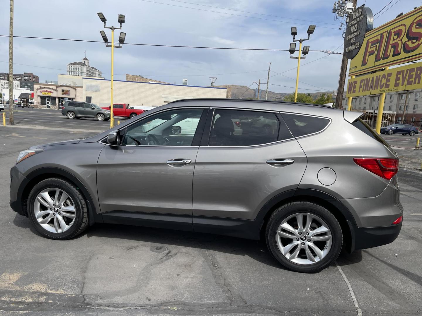 2013 Bamboo Pearl /Black Hyundai Santa Fe Sport 2.0 AWD (5XYZUDLA9DG) with an 2.0L L4 DOHC 16V engine, 6-Speed Automatic transmission, located at 801 South State Street, Salt Lake City, UT, 84111, (801) 328-0098, 40.751953, -111.888206 - Clean title no accidents!!! Super clean with very low miles only 67k miles very clean hard to find! This is perfect for the snow with all wheel drive perfect all around year SUV! Immaculate condition inside and out Carfax shows all regular service was done and cared for. The 2013 Hyundai Santa Fe 2. - Photo#9