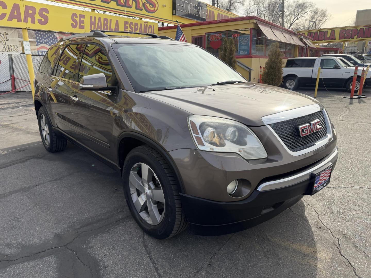 2011 Harvest Gold Metallic /Black GMC Acadia SLT-1 AWD (1GKKVRED7BJ) with an 3.6L V6 DOHC 24V engine, 6-Speed Automatic transmission, located at 801 South State Street, Salt Lake City, UT, 84111, (801) 328-0098, 40.751953, -111.888206 - Clean Title! Immaculate condition inside and out! All Wheel Drive great in the snow! DVD system in the rear entertainment, Bose sound system, rear backup camera! Lots of extras! Must see for anyone looking for a clean affordable SUV!!!! Features: 4WD/AWD, ABS Brakes, Air Conditioning, Alloy Wheels - Photo#3