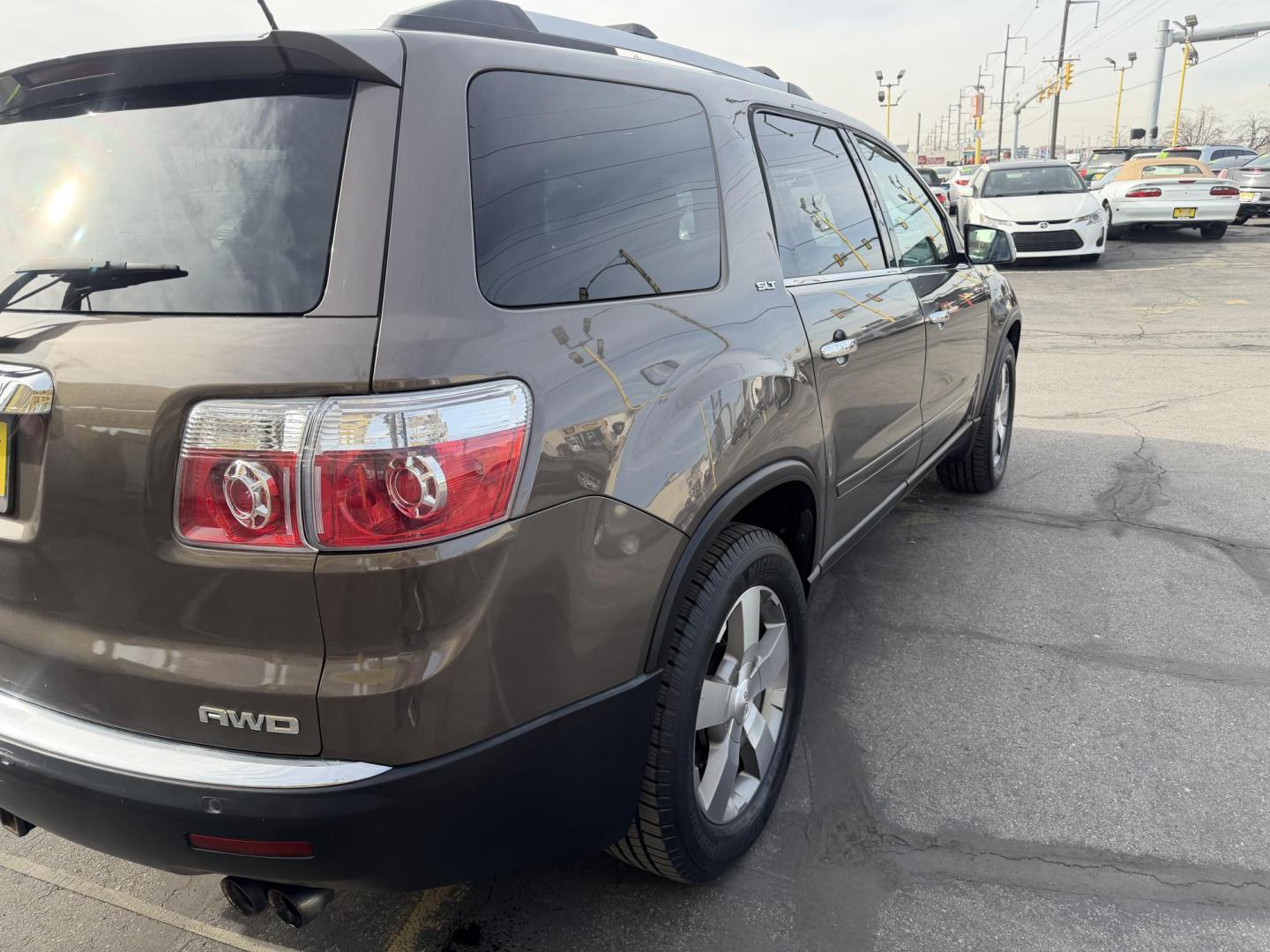 2011 Harvest Gold Metallic /Black GMC Acadia SLT-1 AWD (1GKKVRED7BJ) with an 3.6L V6 DOHC 24V engine, 6-Speed Automatic transmission, located at 801 South State Street, Salt Lake City, UT, 84111, (801) 328-0098, 40.751953, -111.888206 - Clean Title! Immaculate condition inside and out! All Wheel Drive great in the snow! DVD system in the rear entertainment, Bose sound system, rear backup camera! Lots of extras! Must see for anyone looking for a clean affordable SUV!!!! Features: 4WD/AWD, ABS Brakes, Air Conditioning, Alloy Wheels - Photo#4