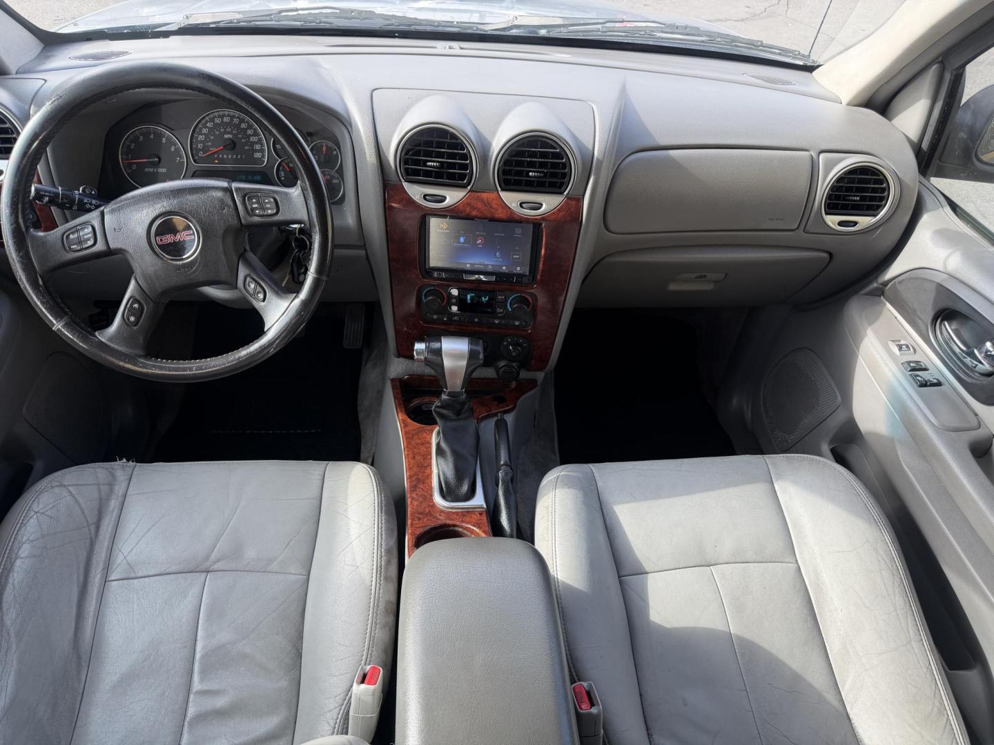 2006 Silver Sky Metallic /Gray GMC Envoy SLE 4WD (1GKDT13S762) with an 4.2L L6 DOHC 24V engine, 4-Speed Automatic Overdrive transmission, located at 801 South State Street, Salt Lake City, UT, 84111, (801) 328-0098, 40.751953, -111.888206 - Clean Title!!! 4x4 SUV Great in the snow and all around year! Good tires. Great shape this is an affordable suv that has been maintained and cared for. Passed all mechanical inspections and approved for up to a 5 year warranty that can be added onto the vehicle price. Features: 4x4, Leather seats, - Photo#14