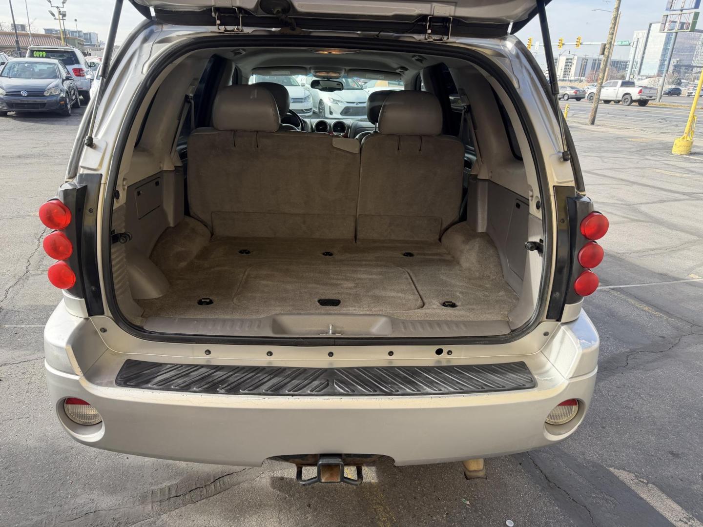 2006 Silver Sky Metallic /Gray GMC Envoy SLE 4WD (1GKDT13S762) with an 4.2L L6 DOHC 24V engine, 4-Speed Automatic Overdrive transmission, located at 801 South State Street, Salt Lake City, UT, 84111, (801) 328-0098, 40.751953, -111.888206 - Clean Title!!! 4x4 SUV Great in the snow and all around year! Good tires. Great shape this is an affordable suv that has been maintained and cared for. Passed all mechanical inspections and approved for up to a 5 year warranty that can be added onto the vehicle price. Features: 4x4, Leather seats, - Photo#25