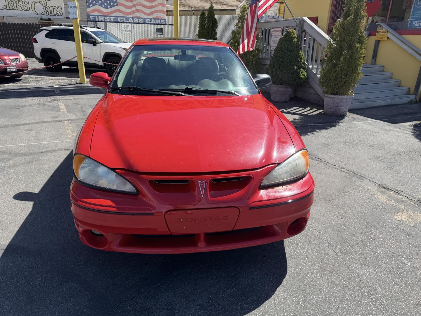 2002 Rallye Red /Black Pontiac Grand AM GT1 sedan (1G2NV52E02C) with an 3.4L V6 OHV 12V engine, 4-Speed Automatic Overdrive transmission, located at 801 South State Street, Salt Lake City, UT, 84111, (801) 328-0098, 40.751953, -111.888206 - Certified Carfax 1-Owner car!!! Clean title! No accidents on Carfax! Immaculate condition inside and out for the year. Hard to find this clean in this condition, vehicle has been meticulously maintained and cared for. Certified for up to a 5 year bumper warranty that can be added onto the vehicle, a - Photo#3