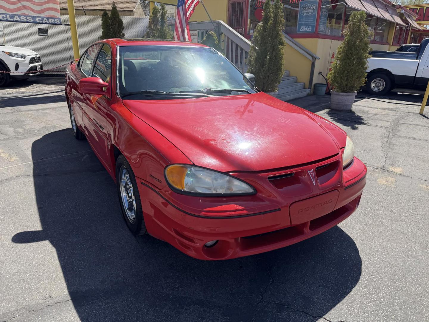 2002 Rallye Red /Black Pontiac Grand AM GT1 sedan (1G2NV52E02C) with an 3.4L V6 OHV 12V engine, 4-Speed Automatic Overdrive transmission, located at 801 South State Street, Salt Lake City, UT, 84111, (801) 328-0098, 40.751953, -111.888206 - Certified Carfax 1-Owner car!!! Clean title! No accidents on Carfax! Immaculate condition inside and out for the year. Hard to find this clean in this condition, vehicle has been meticulously maintained and cared for. Certified for up to a 5 year bumper warranty that can be added onto the vehicle, a - Photo#4